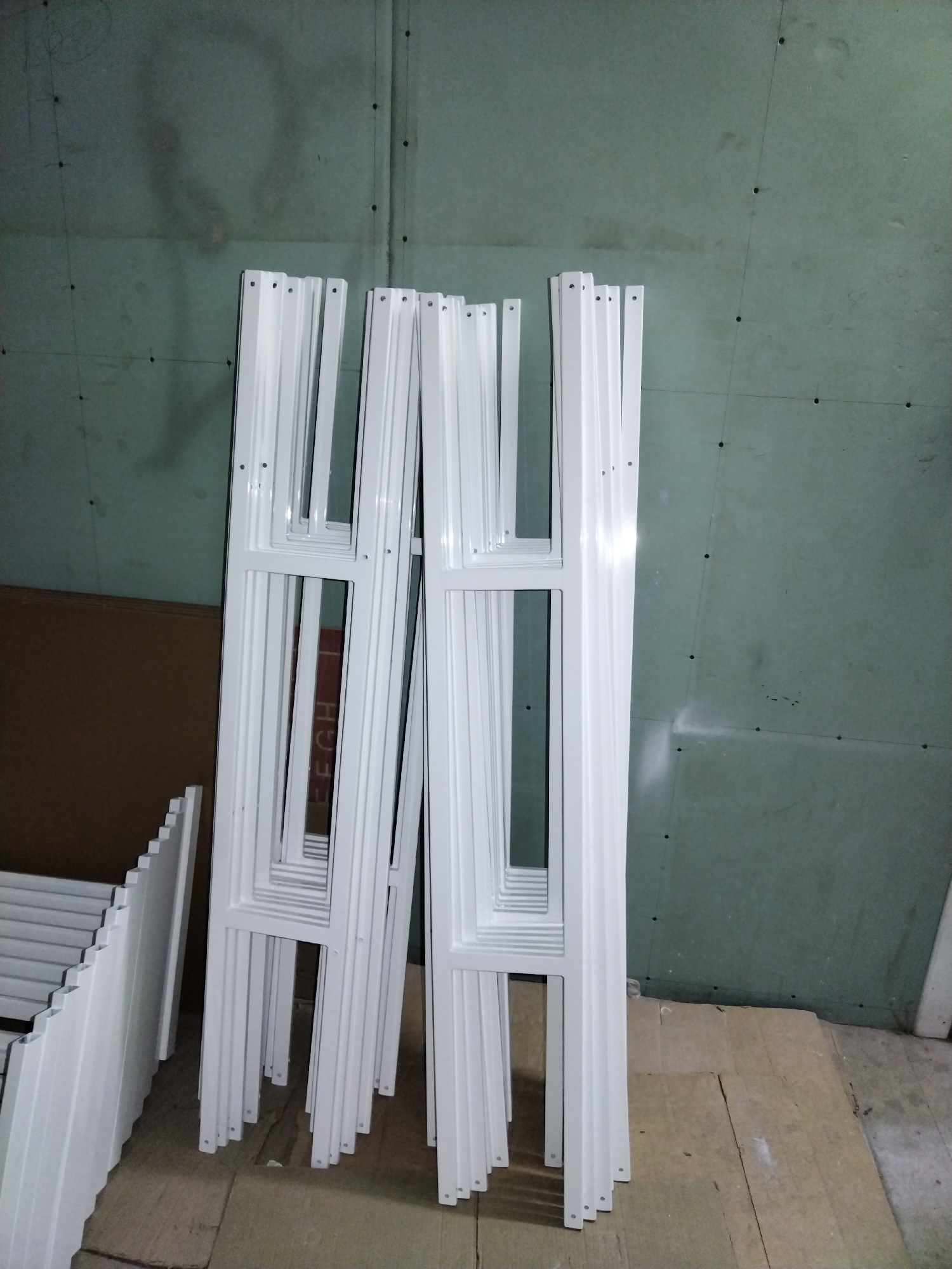 Window frames and labeled end caps in a Pargolovo construction storage area