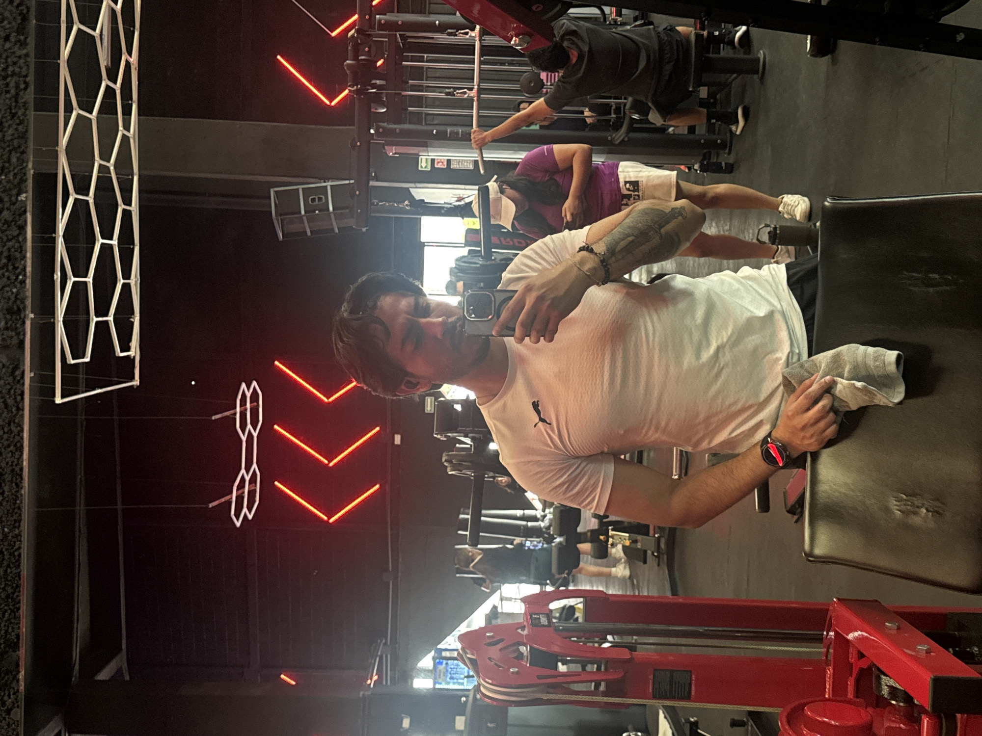 Man takes selfie at Puebla gym during evening workout