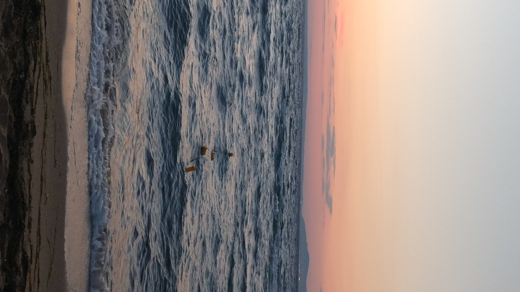 Dusk settles over a quiet beach in Perea, Greece