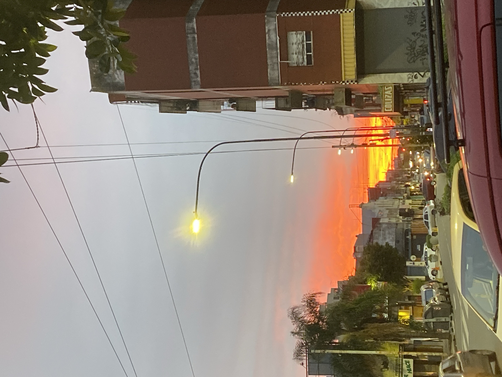 Sunset captured on Buenos Aires street with orange skies