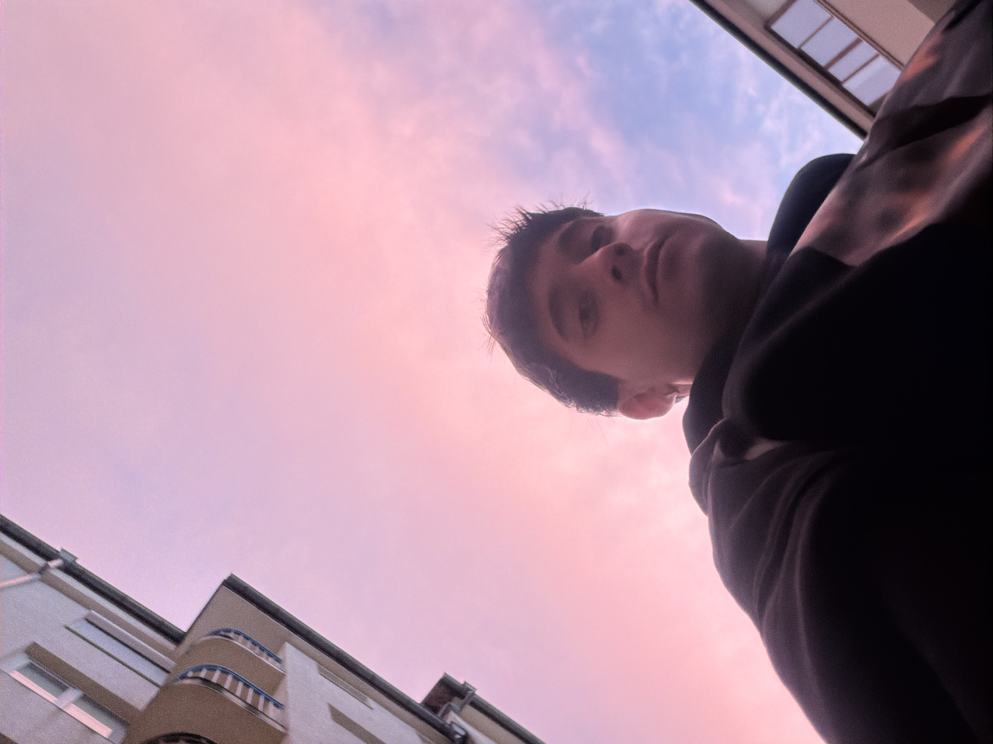 Young person photographed against dramatic twilight sky in Blagoevgrad