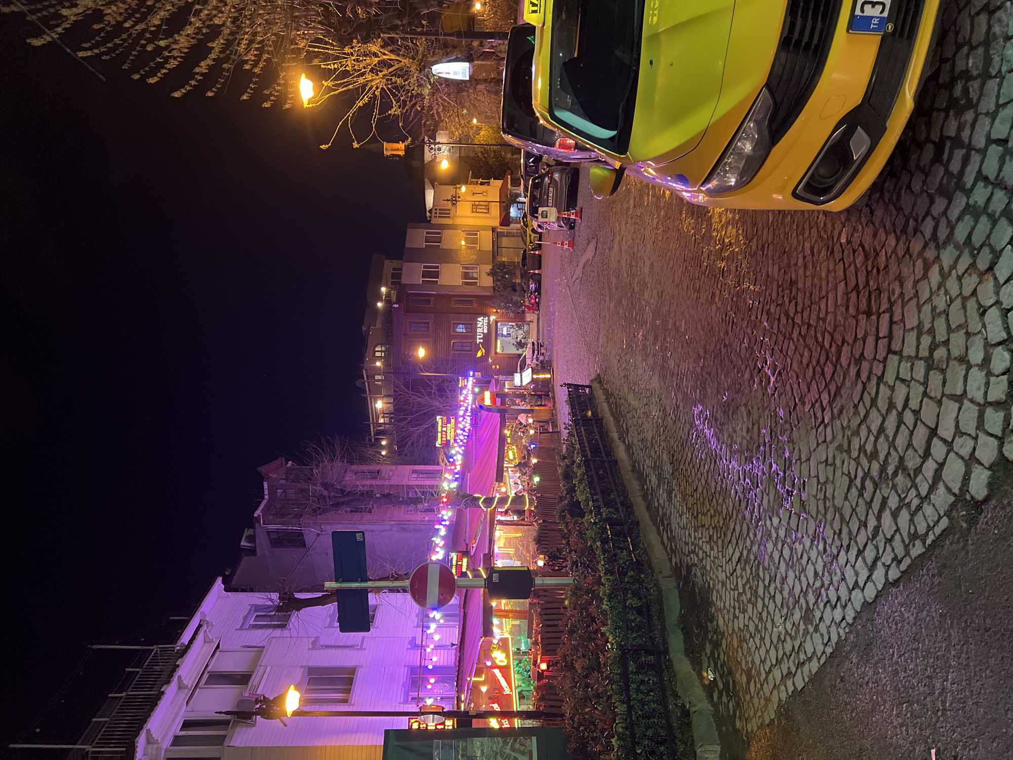 Yellow taxi spotted on Istanbul street at night