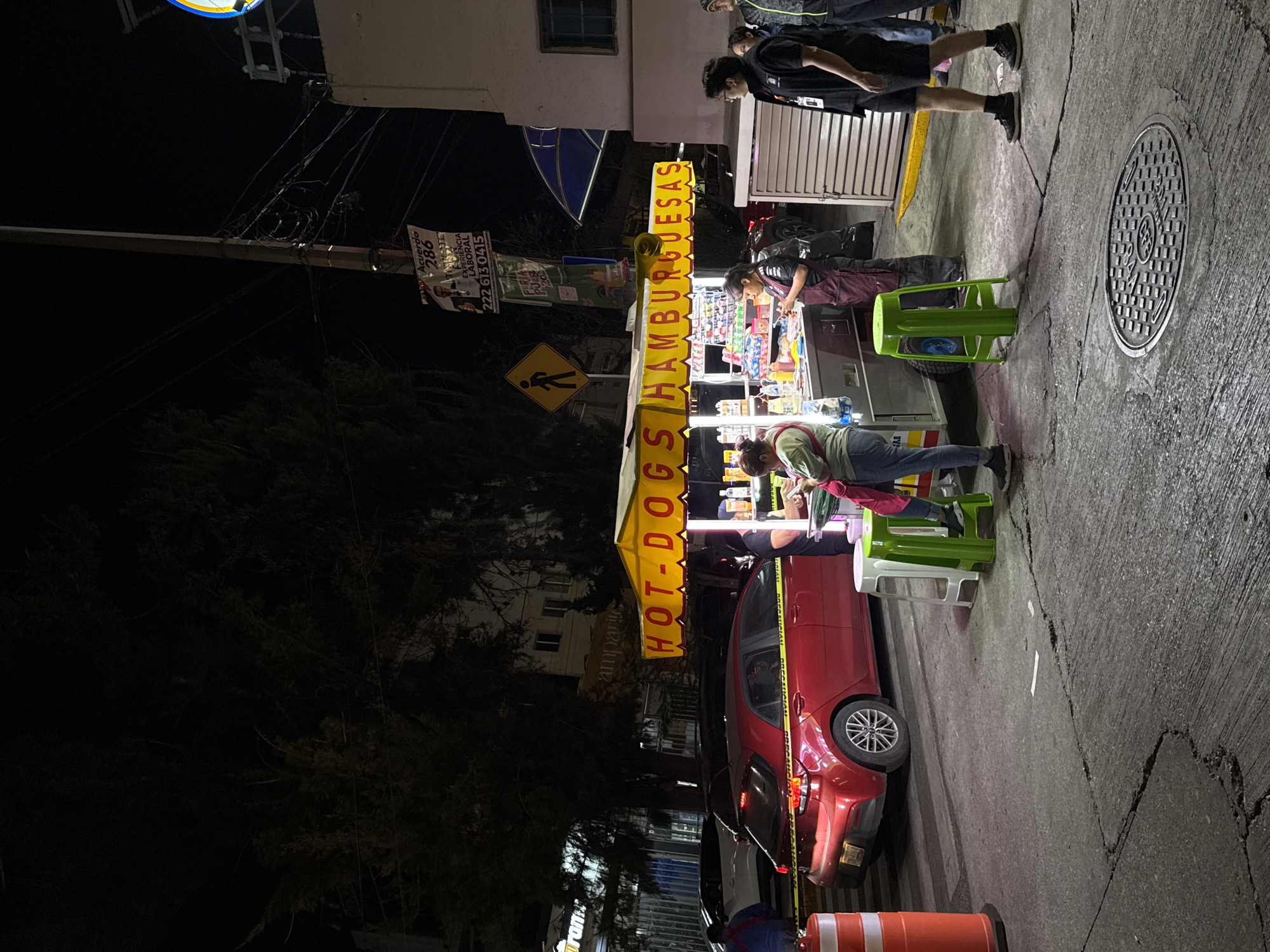 Late-night food cart serves customers in Puebla, Mexico