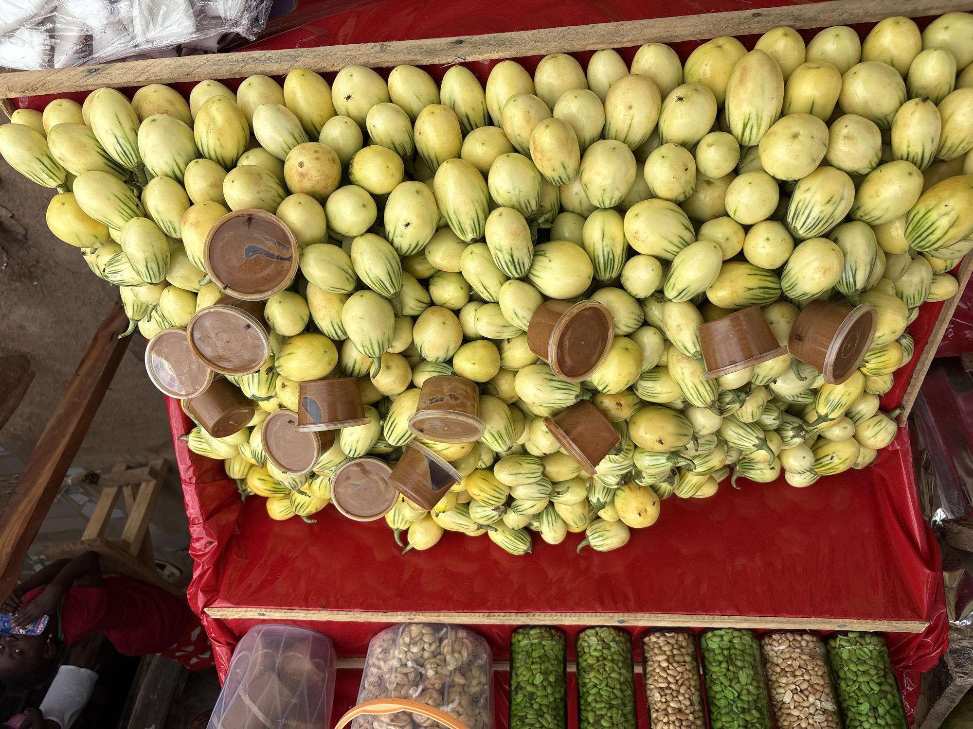 Lafia market stalls loaded with eggplants, watermelons, and dates