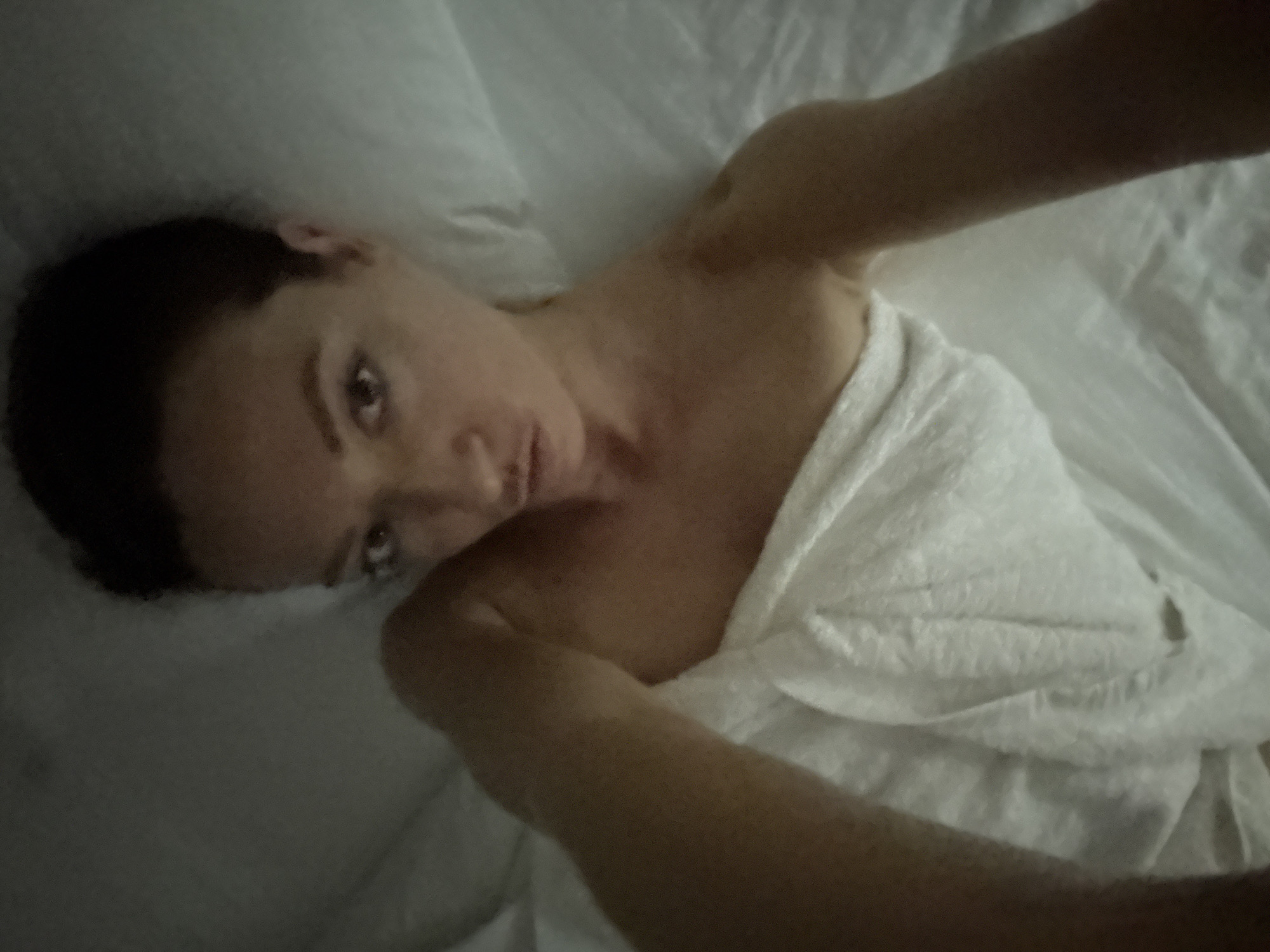 Self-portrait taken on bed in Bản Đêu, Vietnam