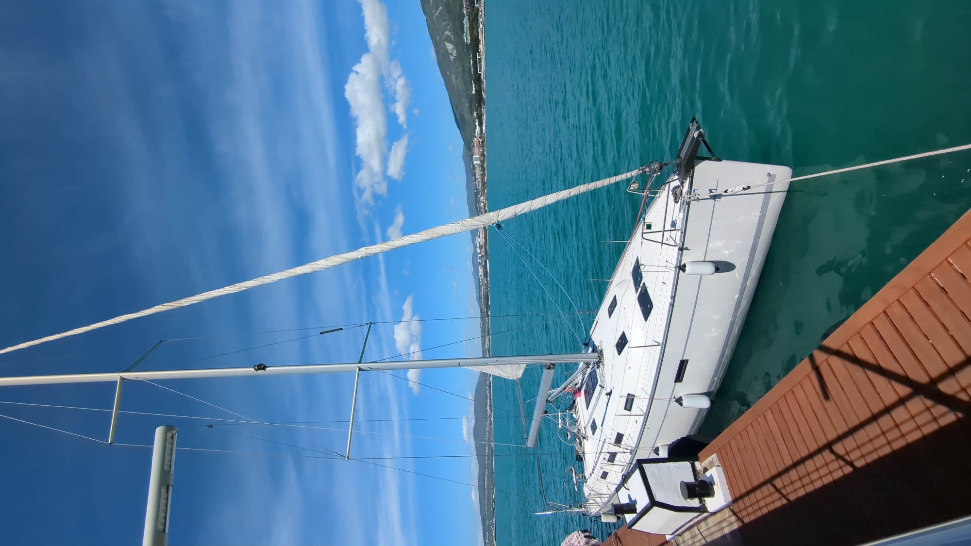 White sailboat spotted at Gelendzhik marina on sunny morning