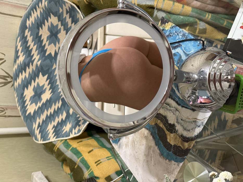 Woman takes repeated mirror selfies in Saint Petersburg bathroom
