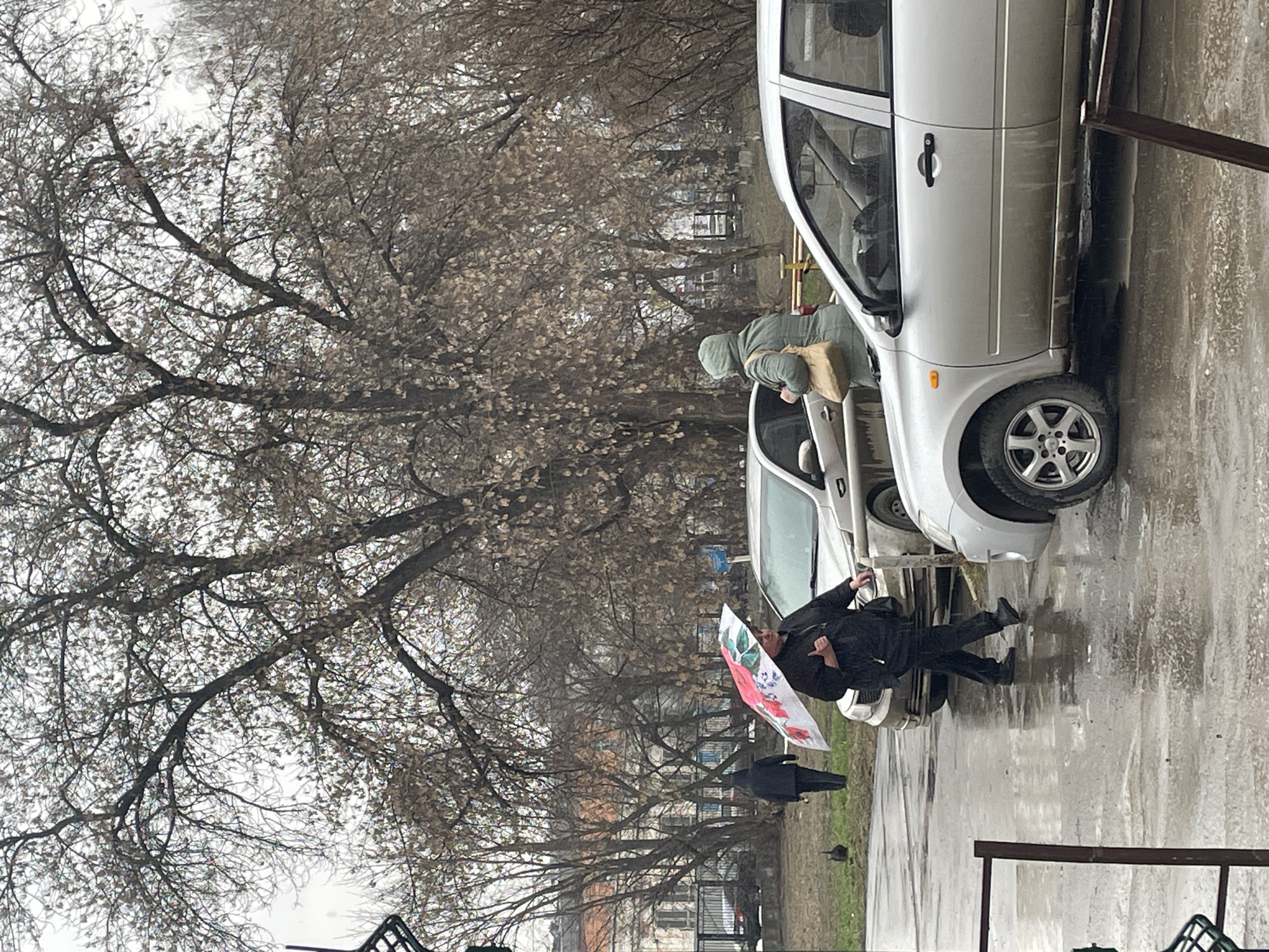 Rainy morning street scene with umbrella in Izhevsk