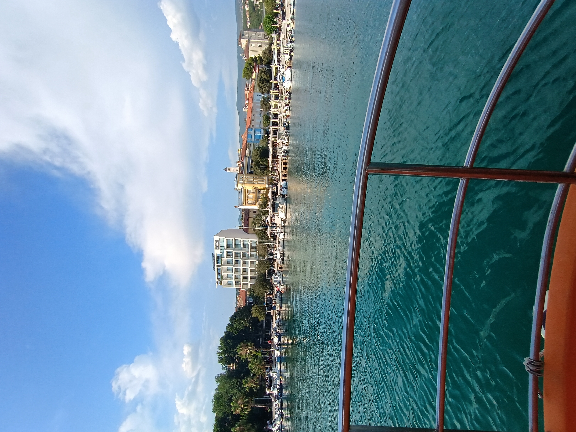 Crikvenica harbor on a summer afternoon, Ferris wheel and boats