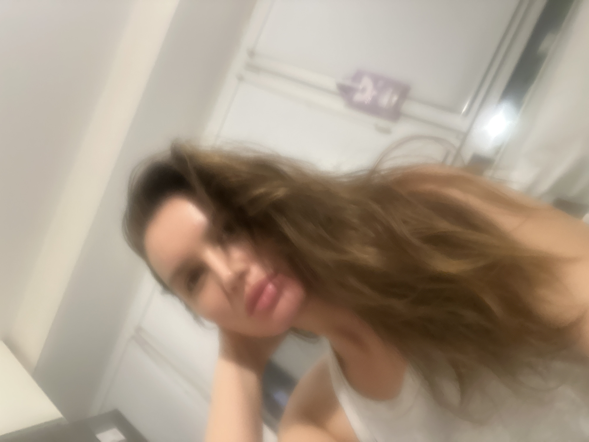 Woman takes evening selfies in Moscow apartment