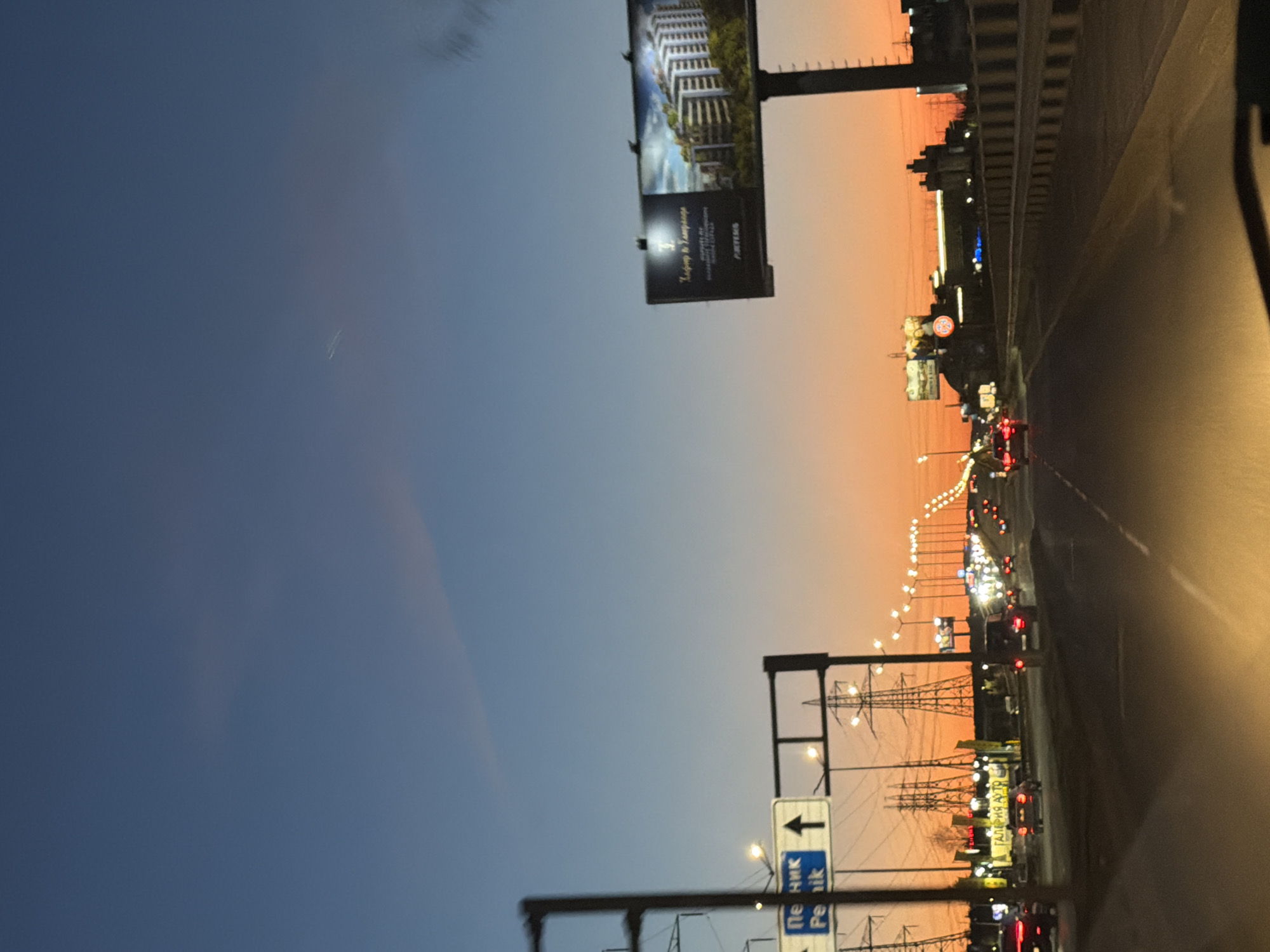 Evening traffic flows through Sofia as dusk settles