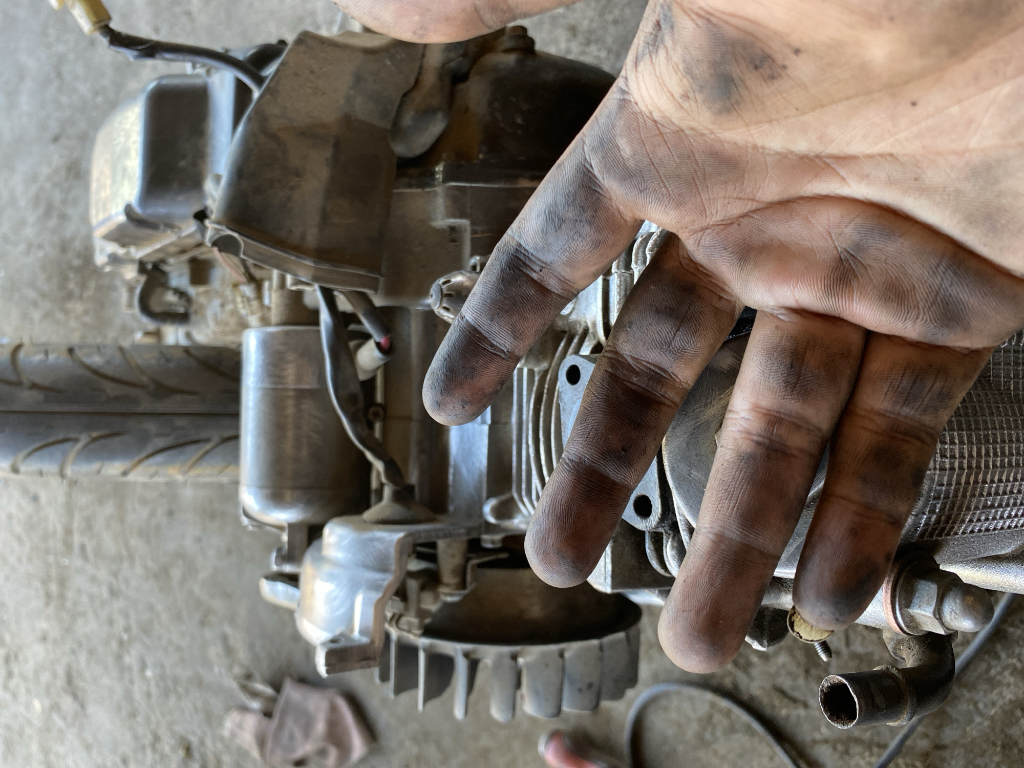 Motorcycle engine teardown and cleaning in Bayu, Indonesia