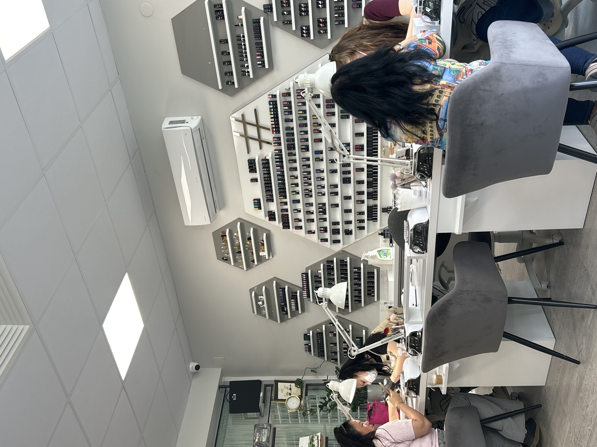 Morning business activity observed at nail salon and cafe