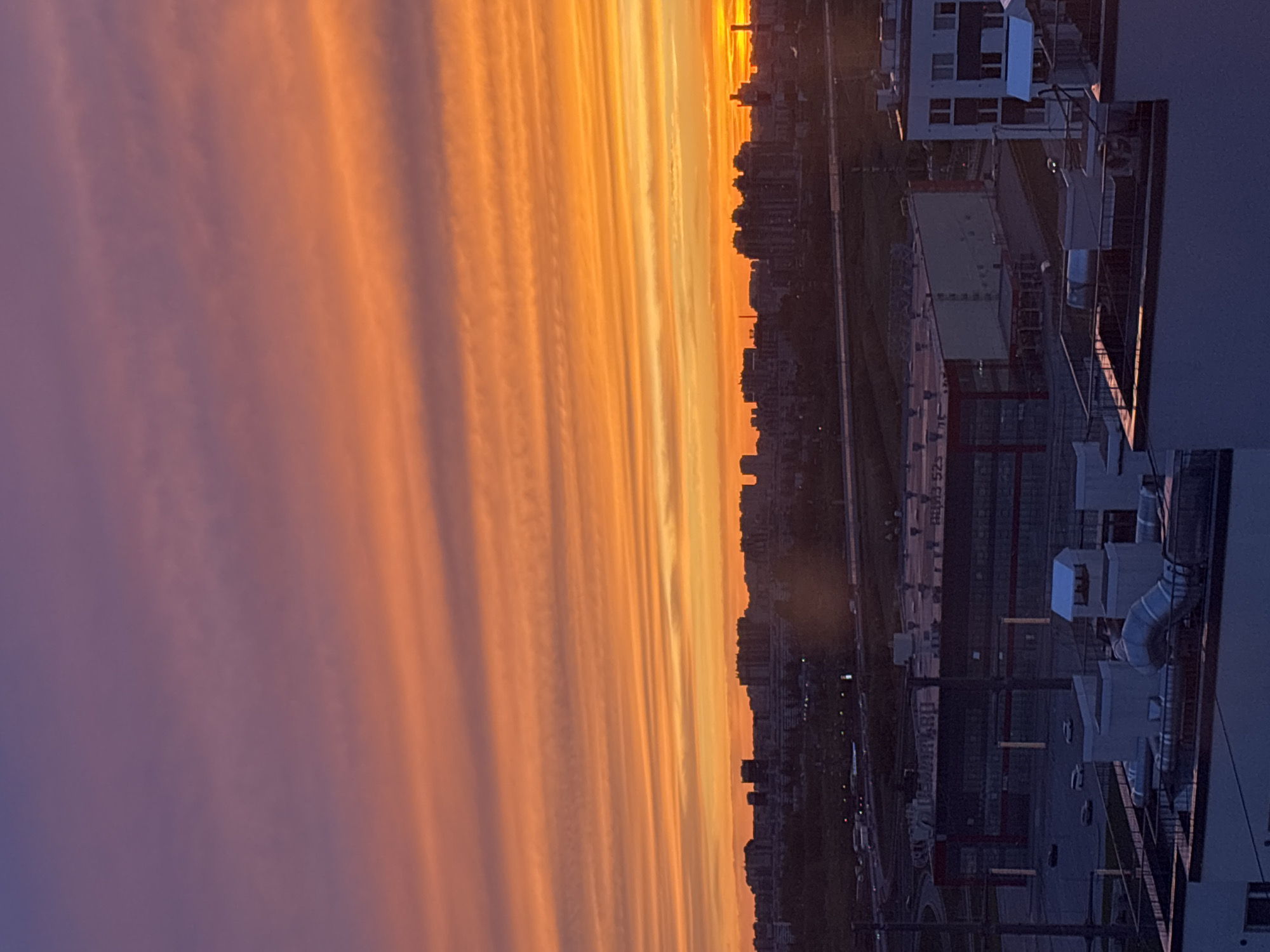 Sunset creates colorful sky over city skyline May 6