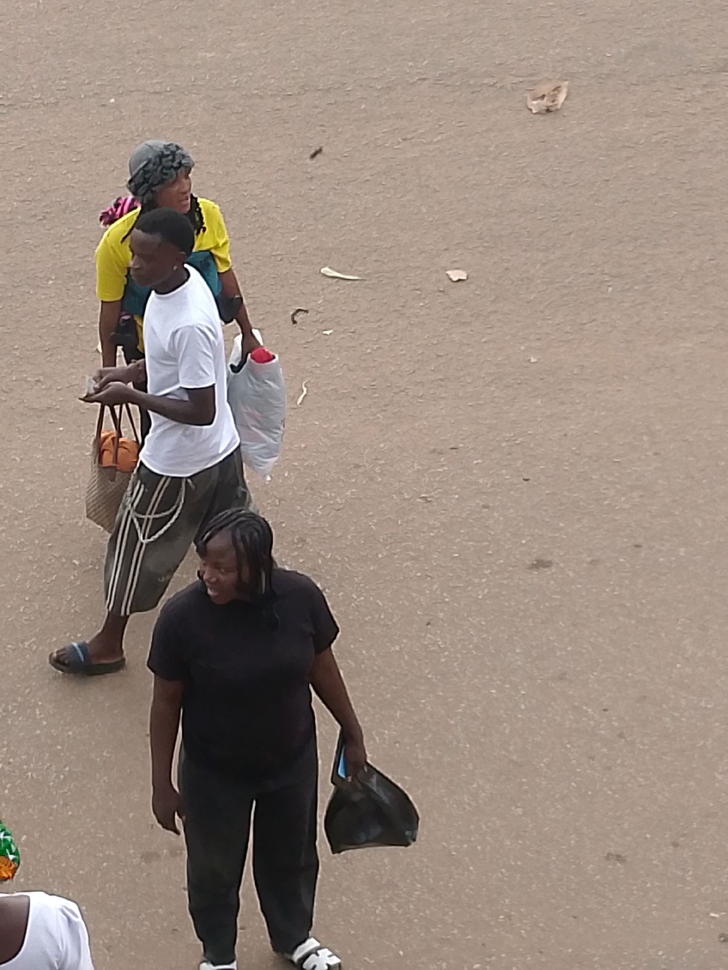 Everyday street life in Bukuru's busy market district