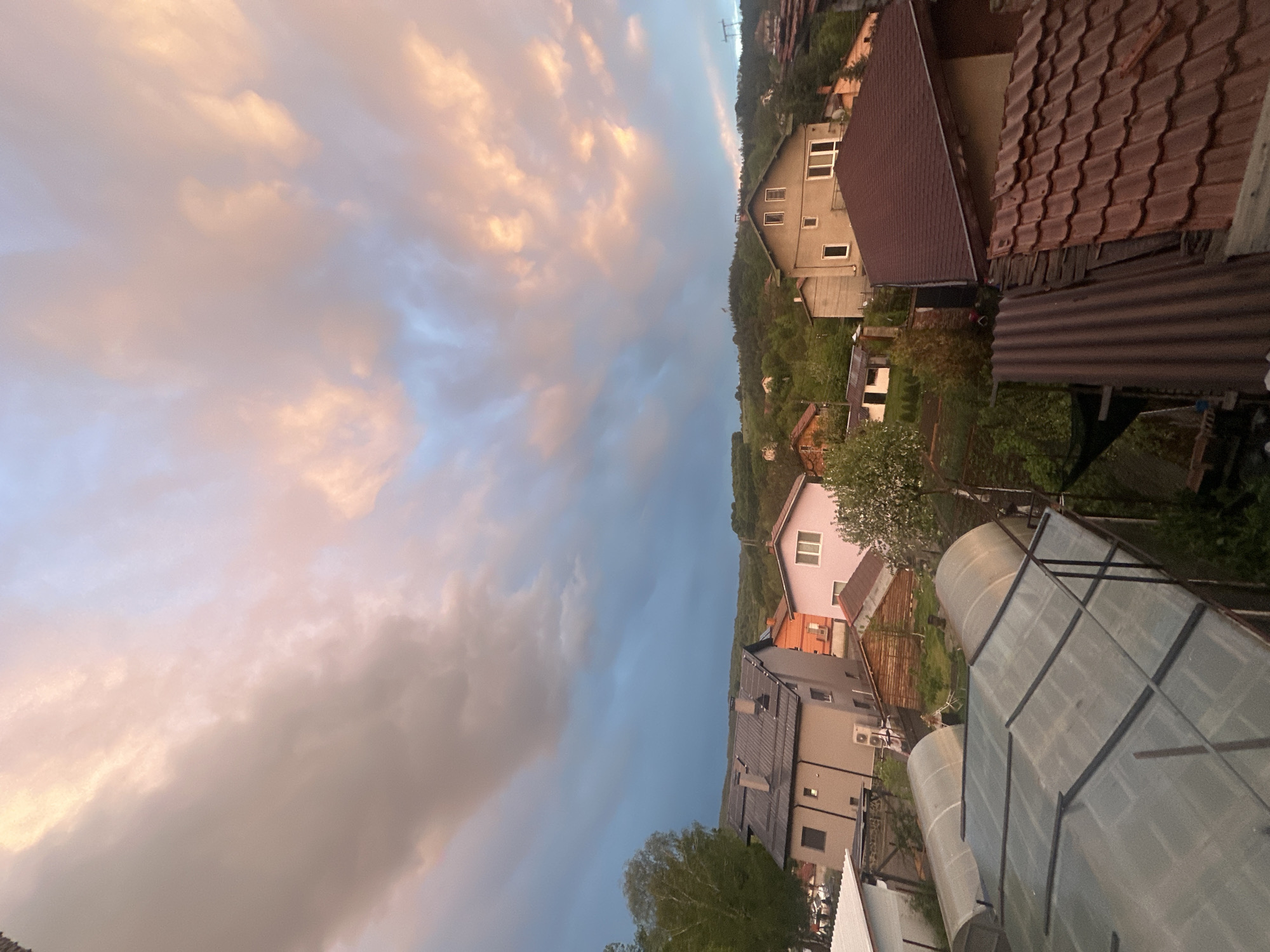 Dusk weather changes captured over Bulgarian village rooftops