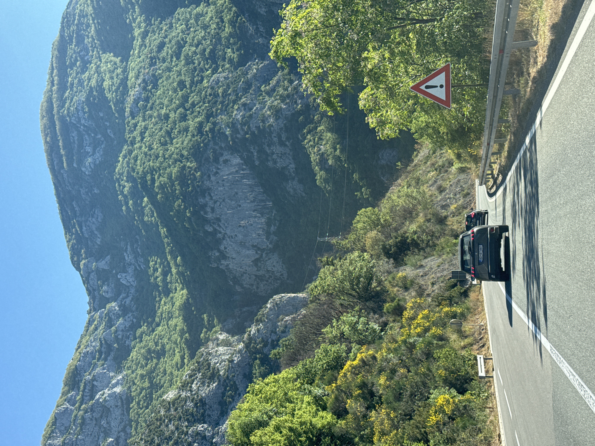 Vehicle travels mountain road in Mišići, Montenegro