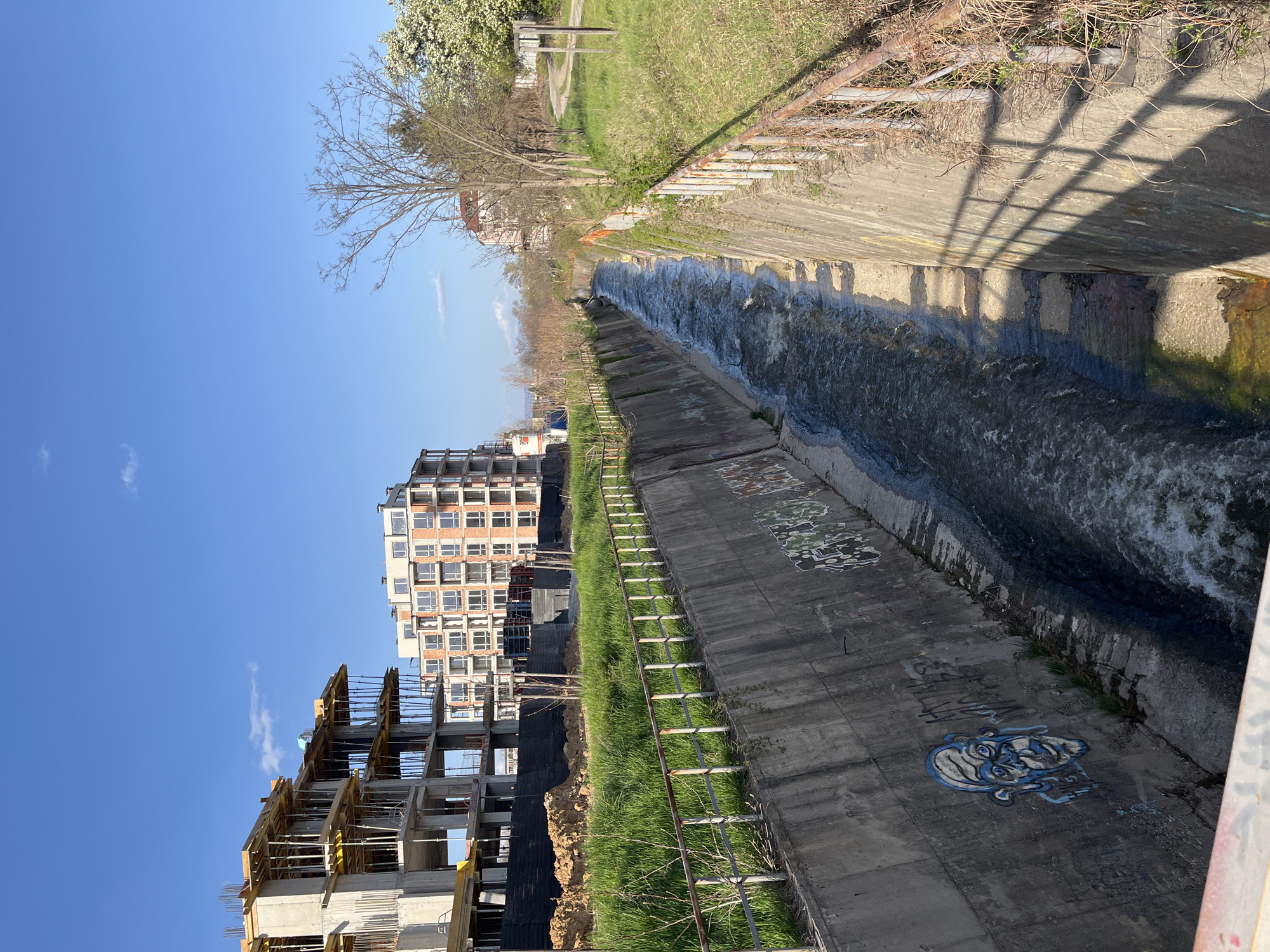 Graffitied water canal documented amid construction in Sofia
