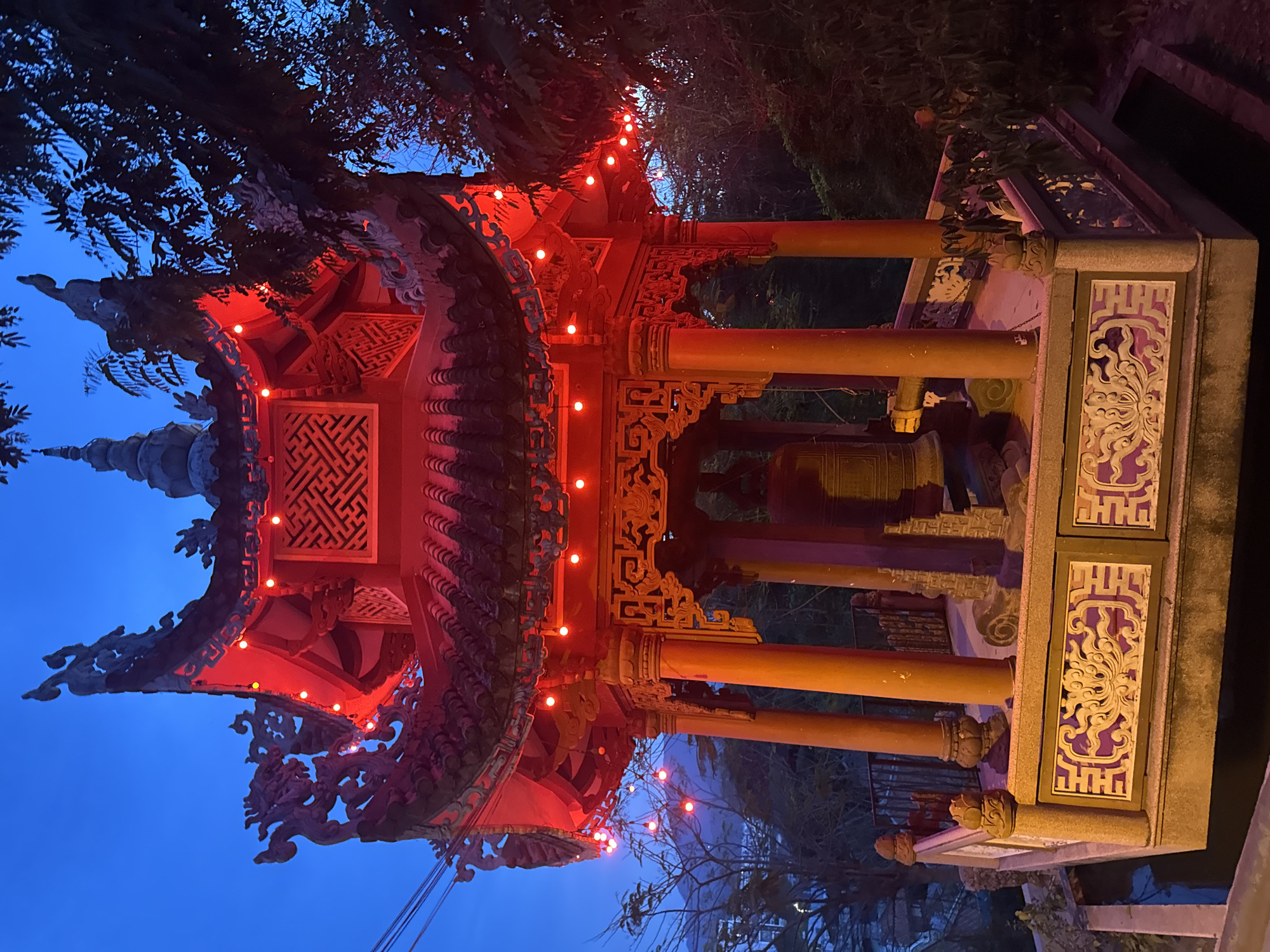 Long Son Pagoda at dusk, dragons and Buddha lit up