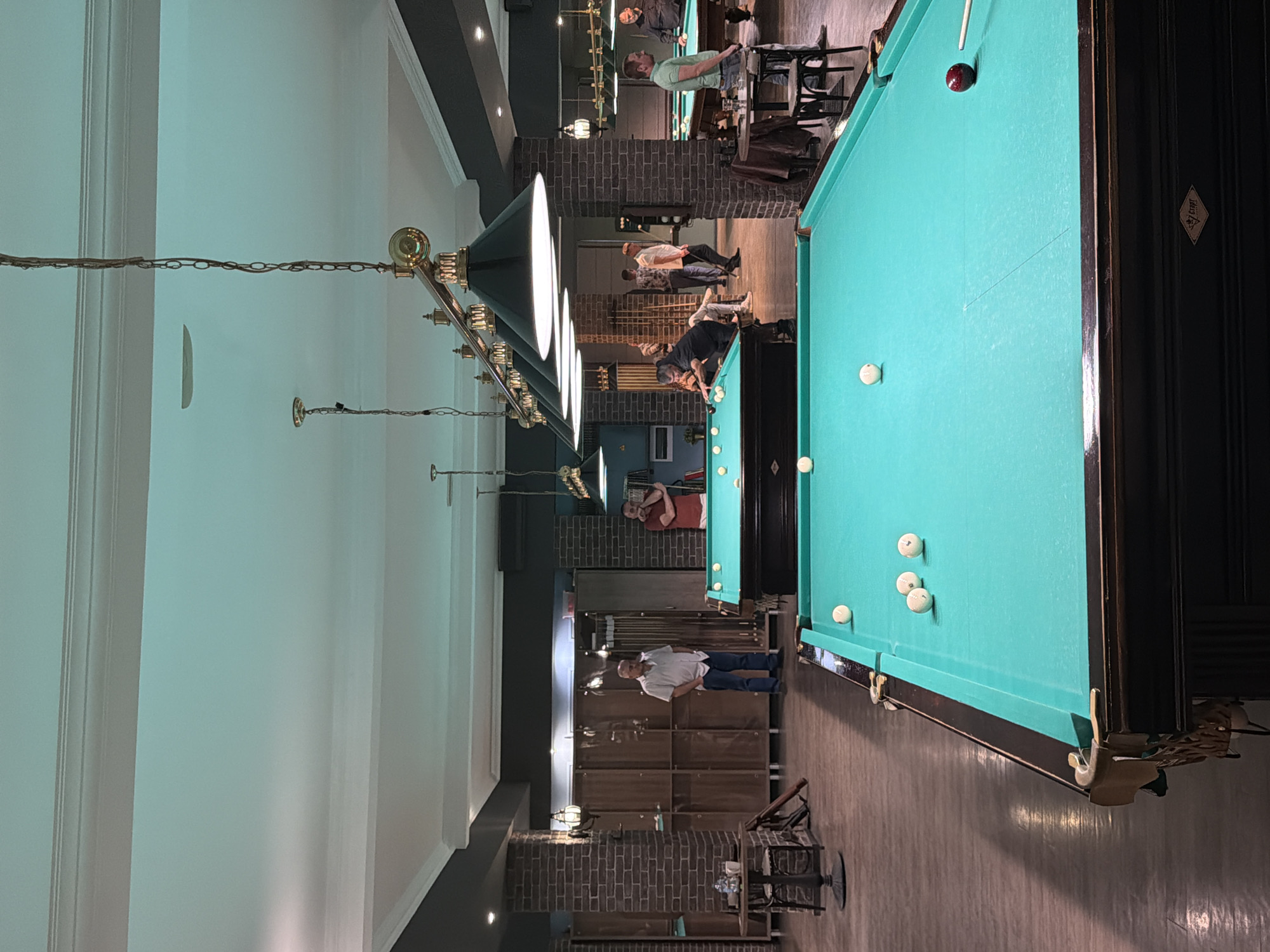 Man plays billiards at Izhevsk hall during afternoon session