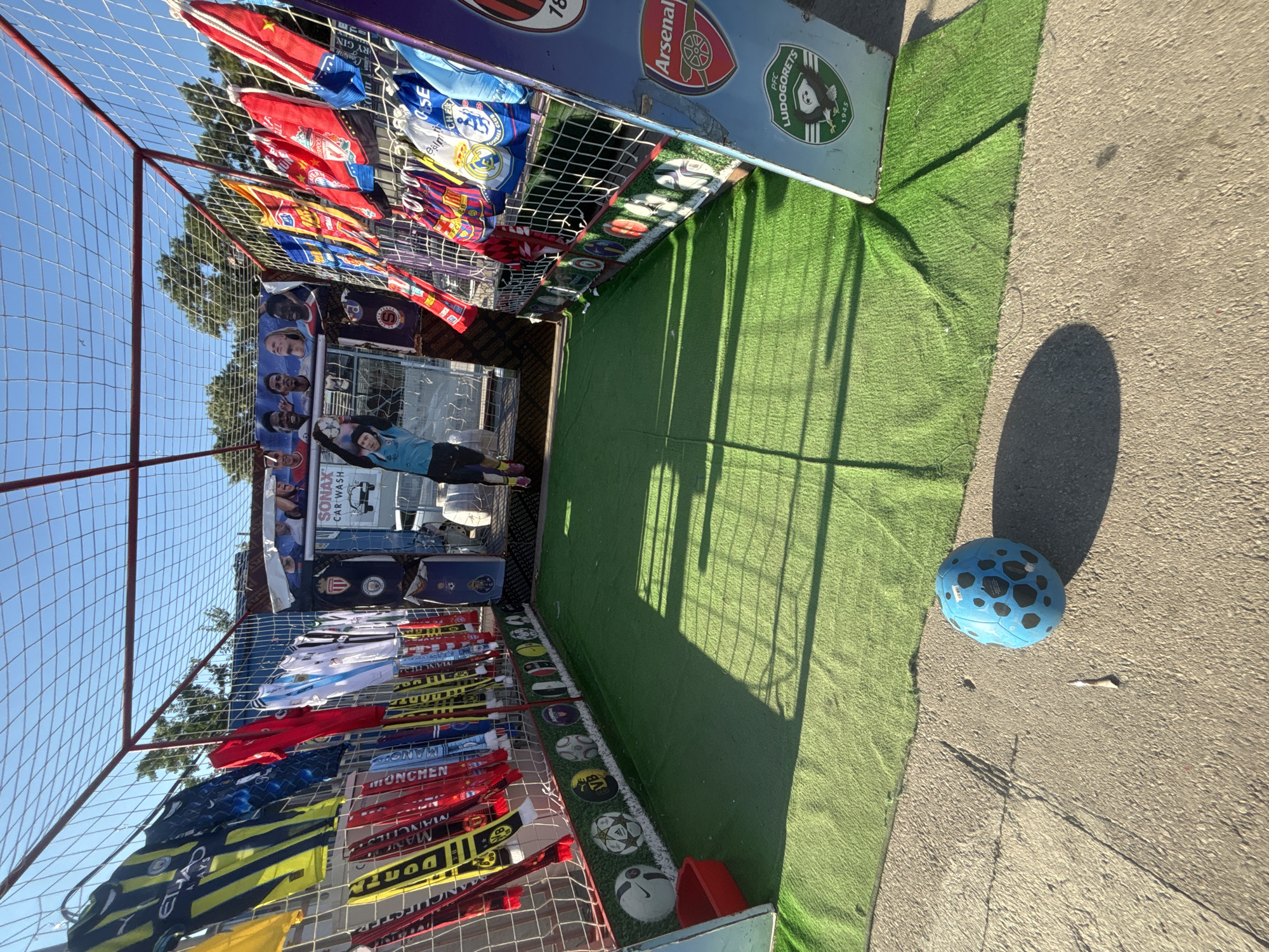 Plush toy prize booth set up at a sunny Varna fair