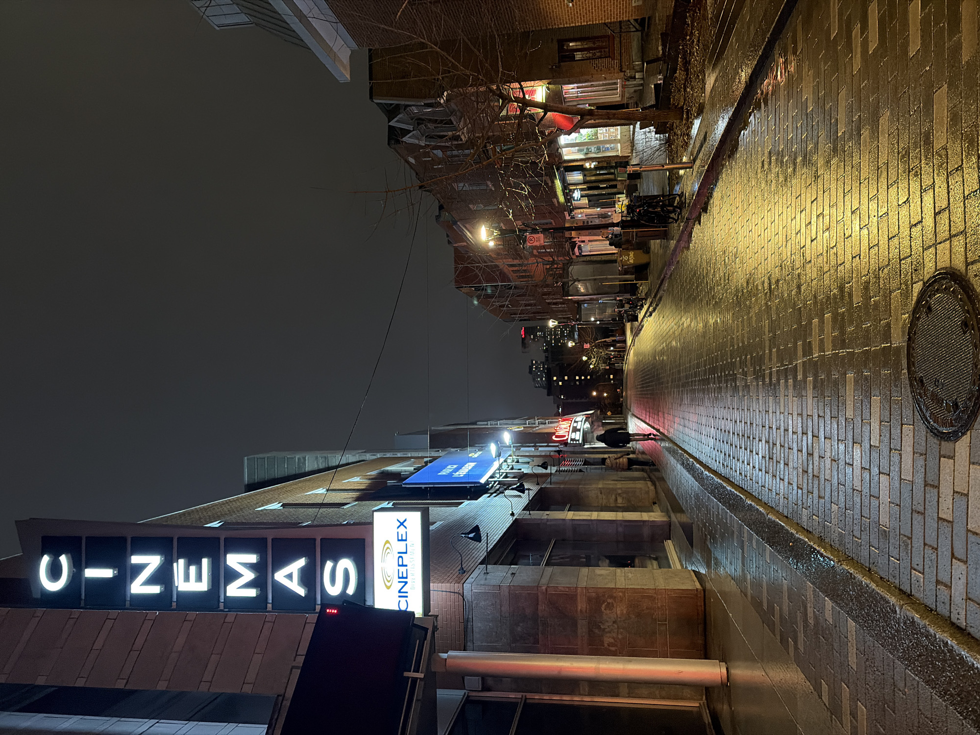Late-night Montreal street scenes captured near cinemas and restaurant