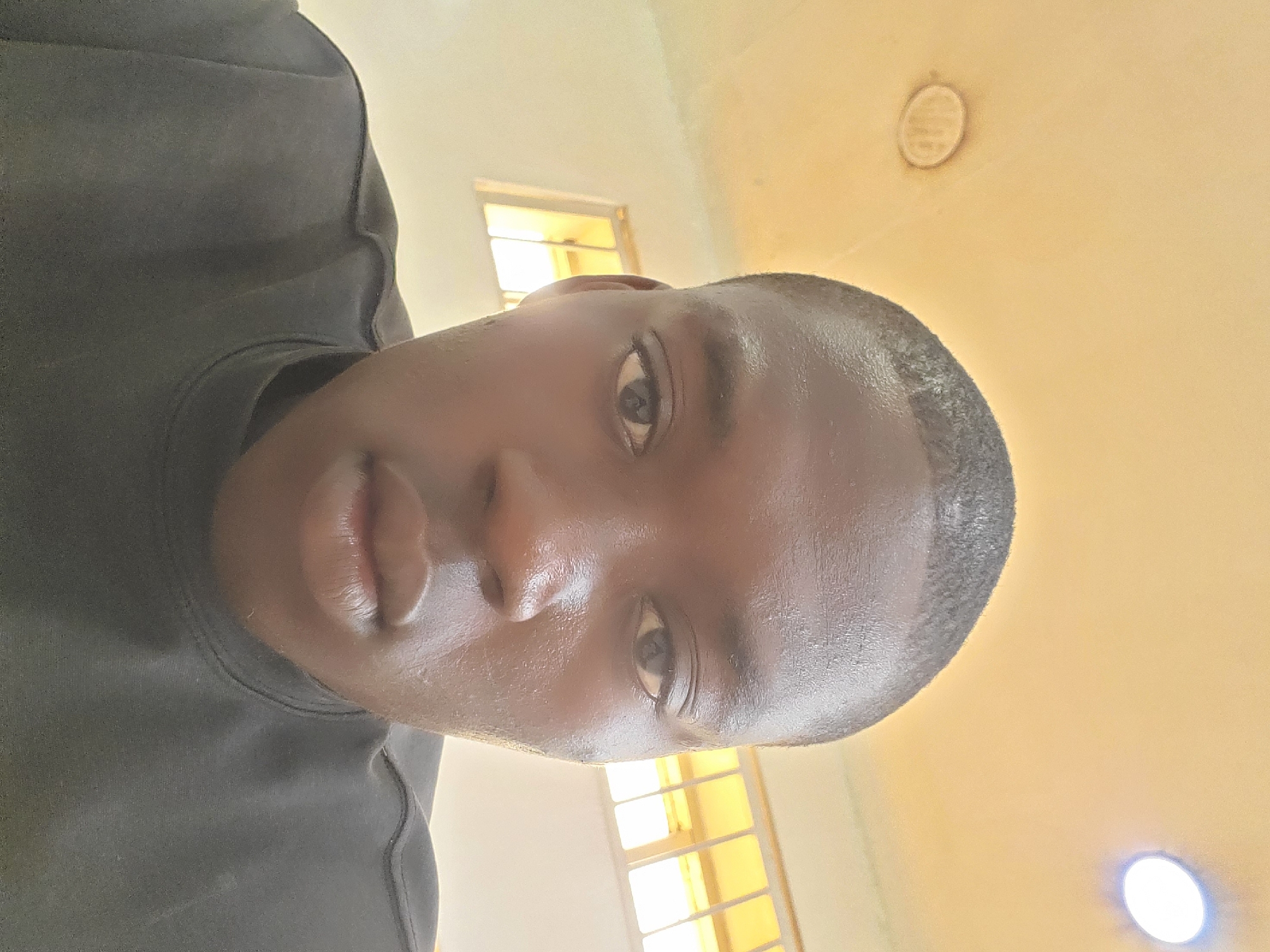 Person takes selfie indoors in Fegge, Nigeria