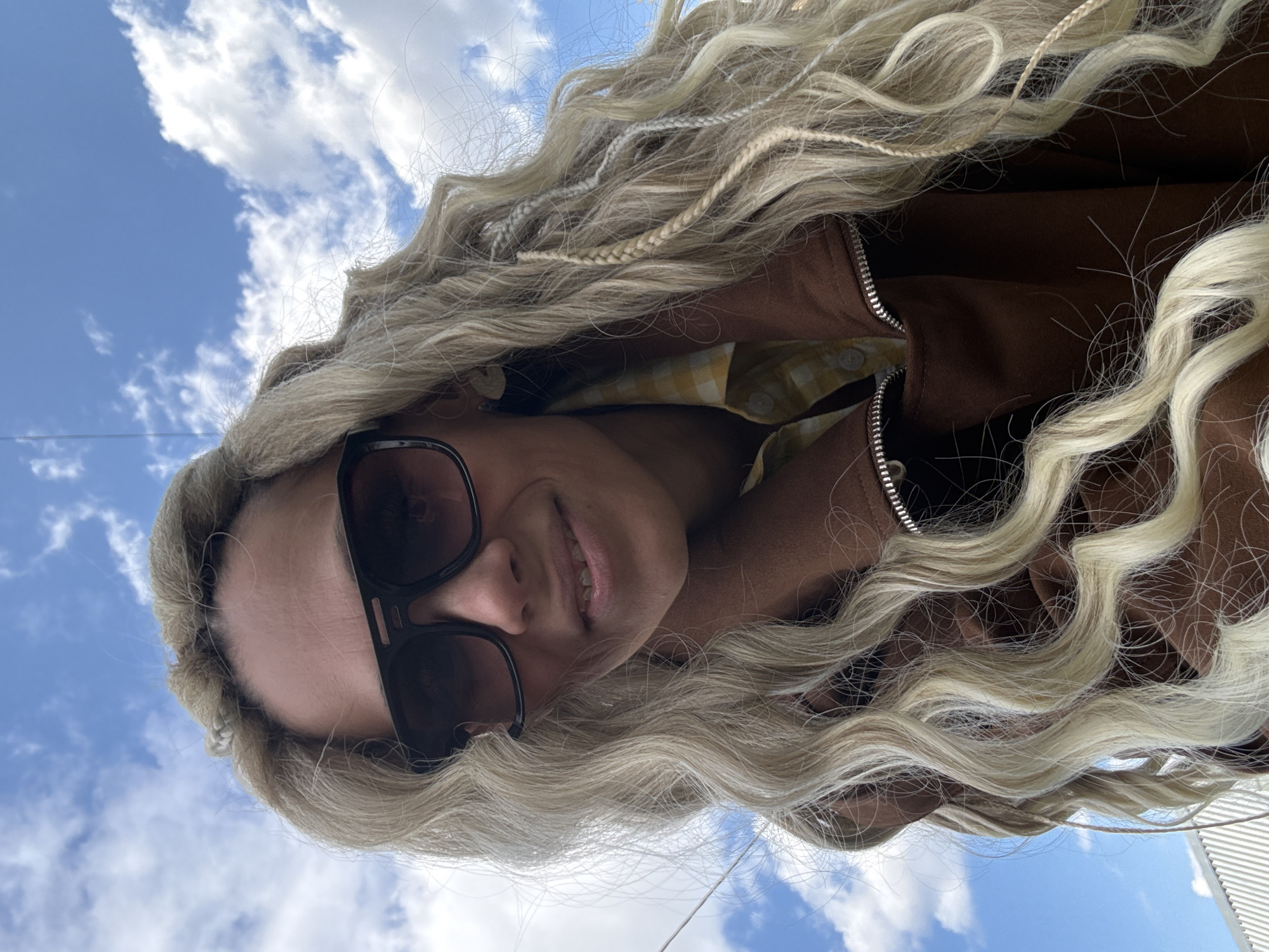 Woman takes multiple selfies outdoors in Rusanovo, Russia