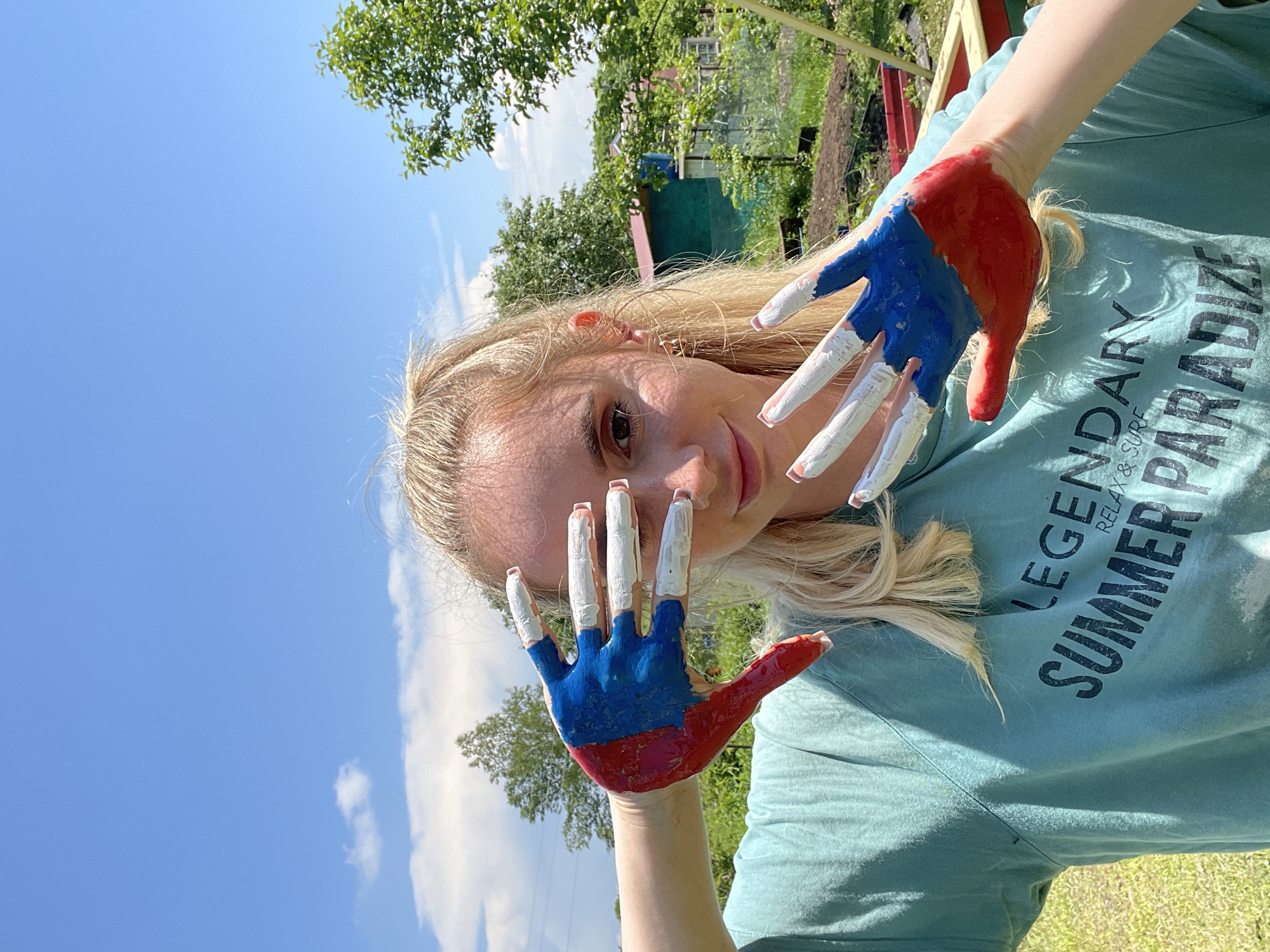 Summer day activities captured in Yasnoe with patriotic hand paint