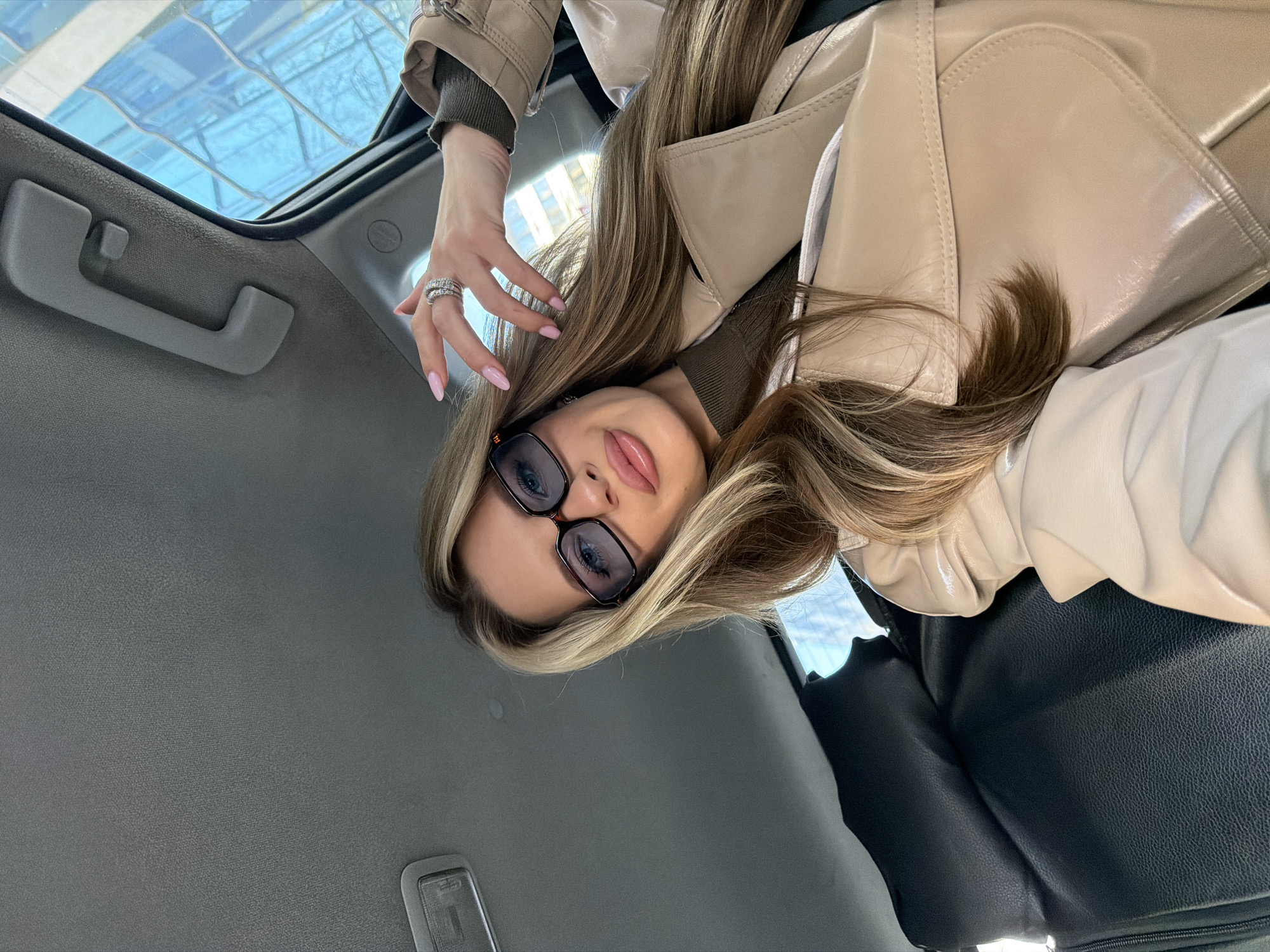 Woman in beige coat observed in car, Berlin