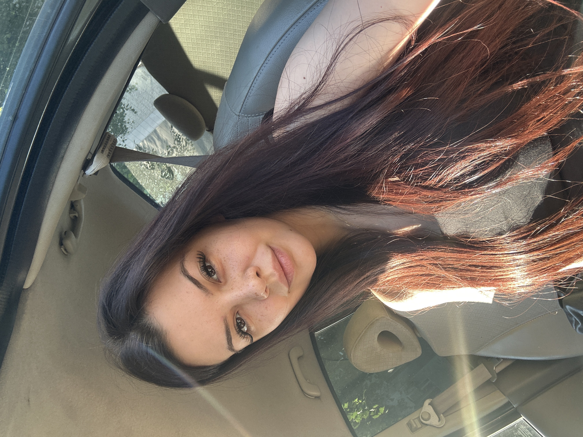 Woman takes early morning car selfies in Sliven, Bulgaria