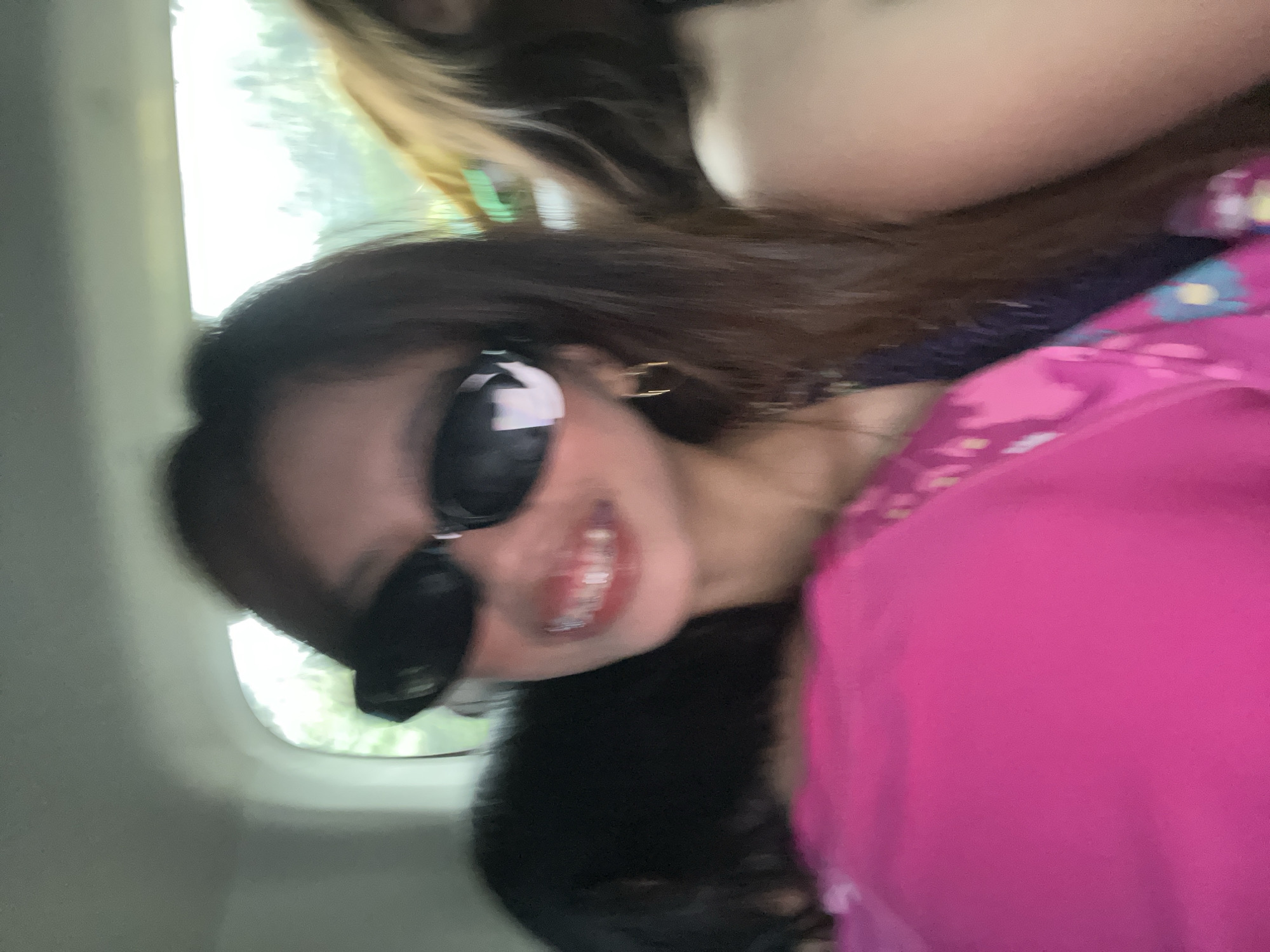 Person in pink floral top photographed smiling in Bongabong