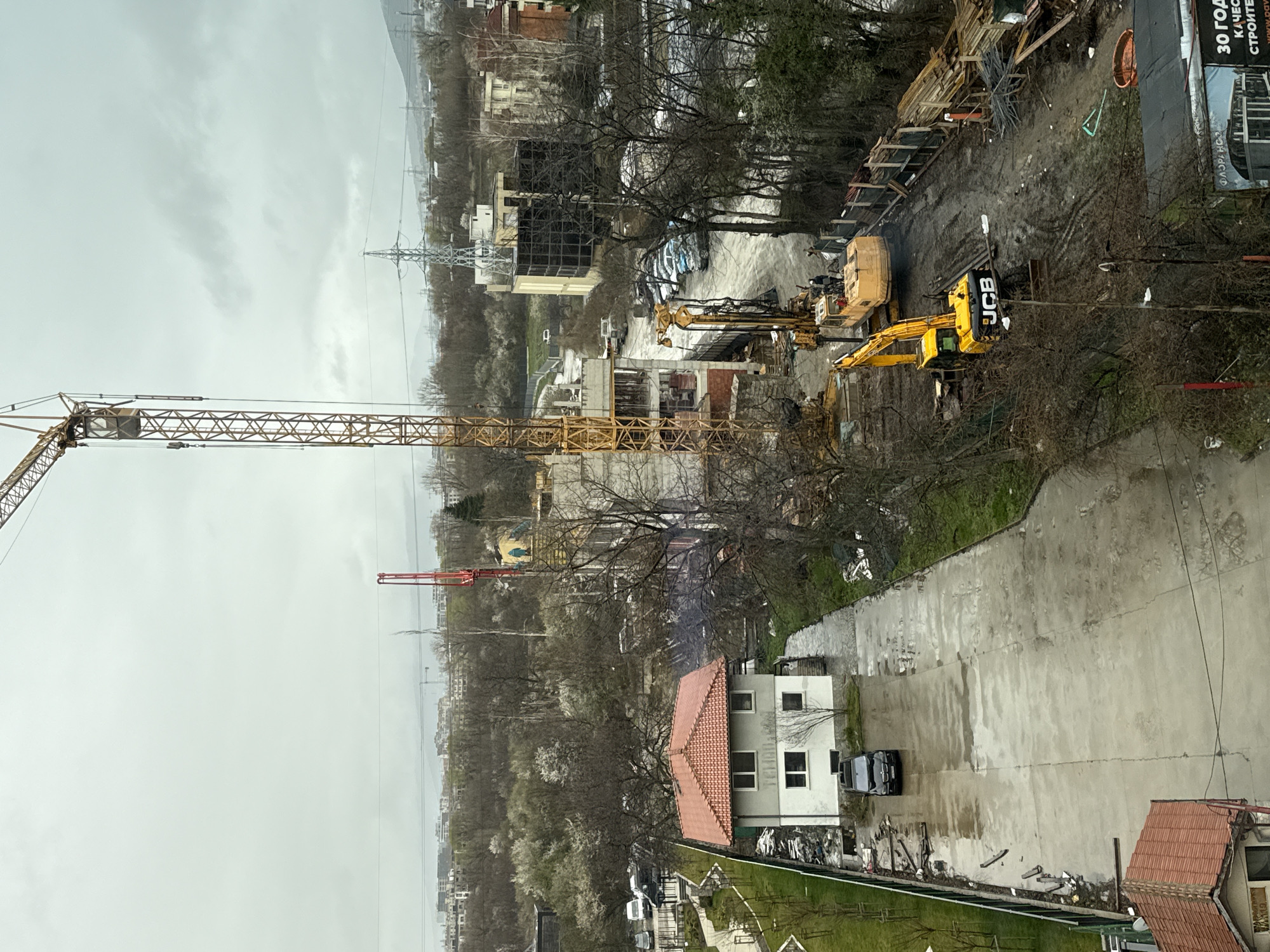 Construction crane towers over active building site in Sofia