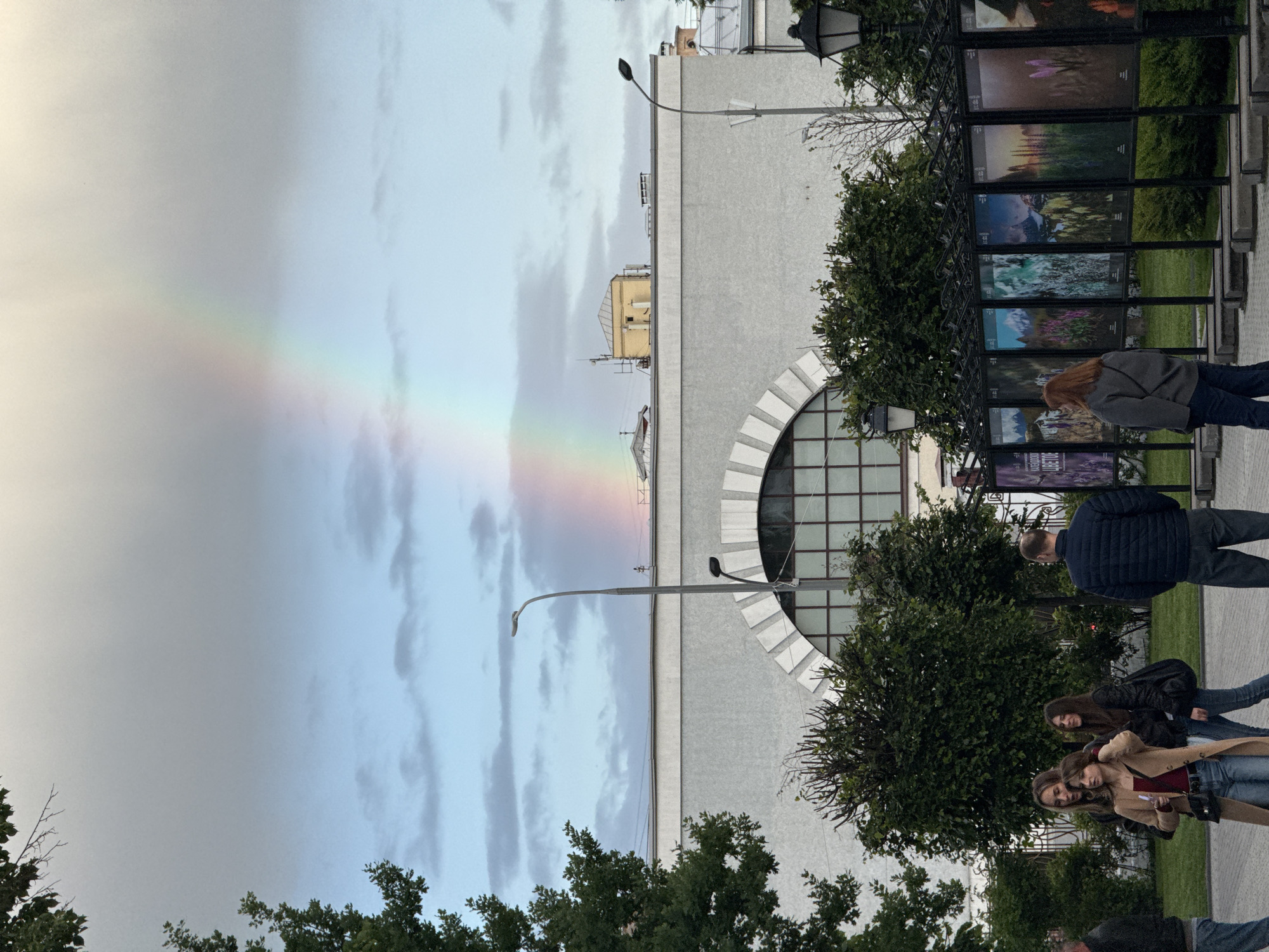 Rainbow spans Moscow skyline during afternoon weather event