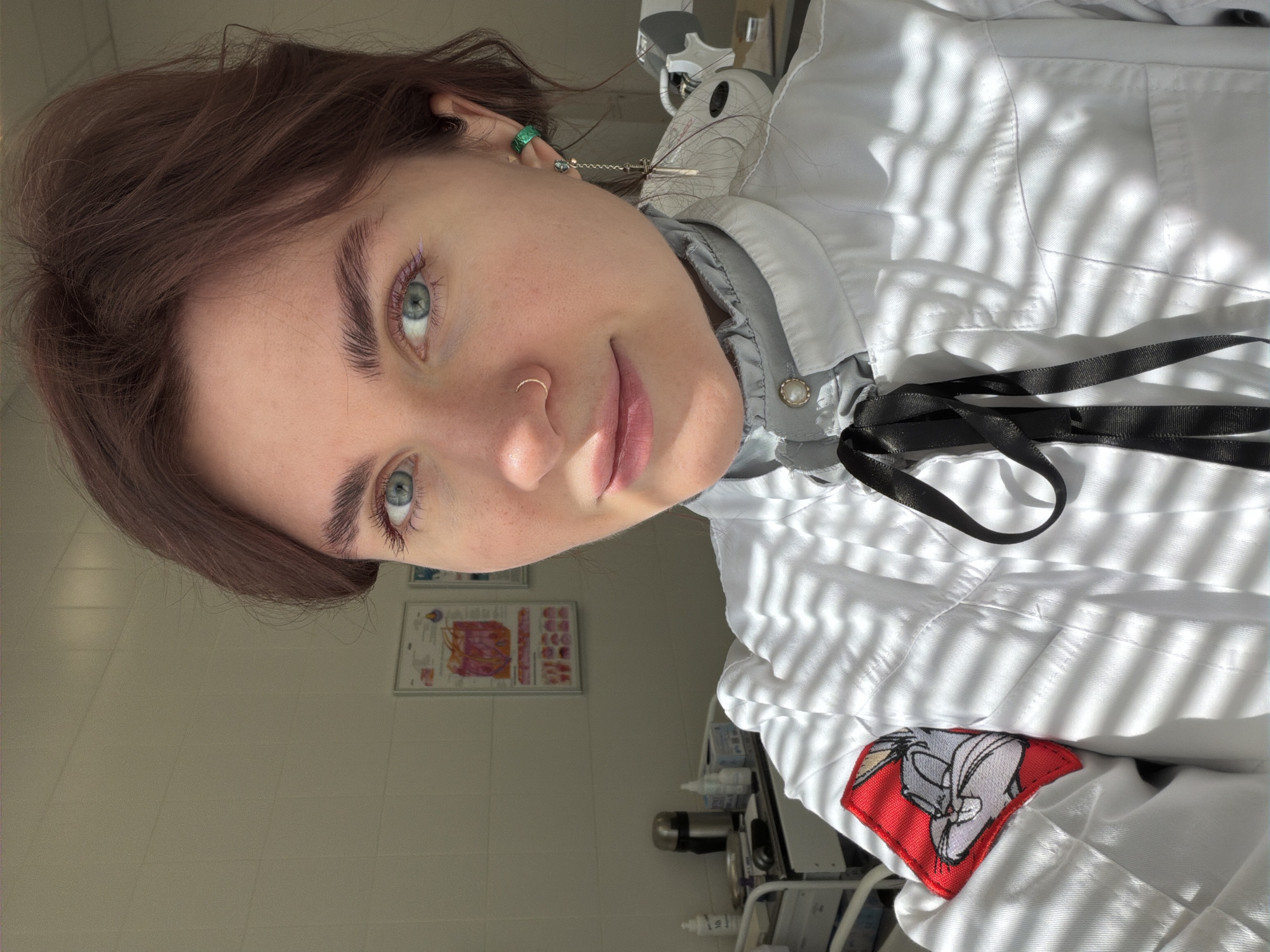 Lab coat-wearing individual observed in Khimki interior setting