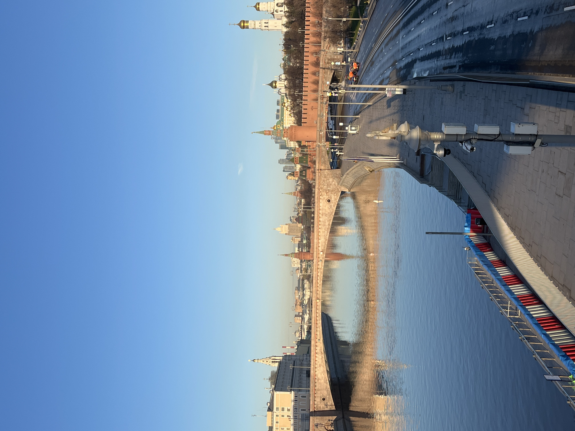 Early morning Kremlin reflection captured on Moscow riverbank