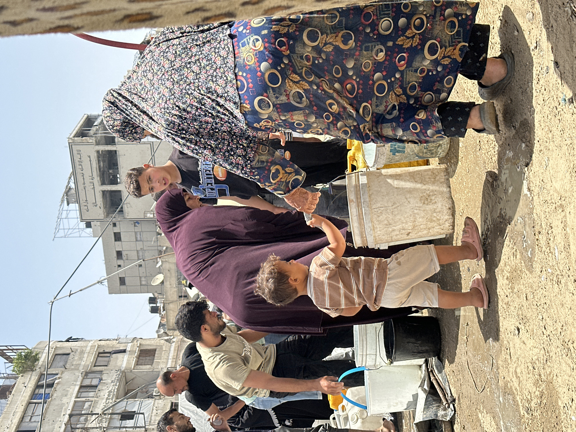 Gaza families gather buckets amid ongoing daily challenges