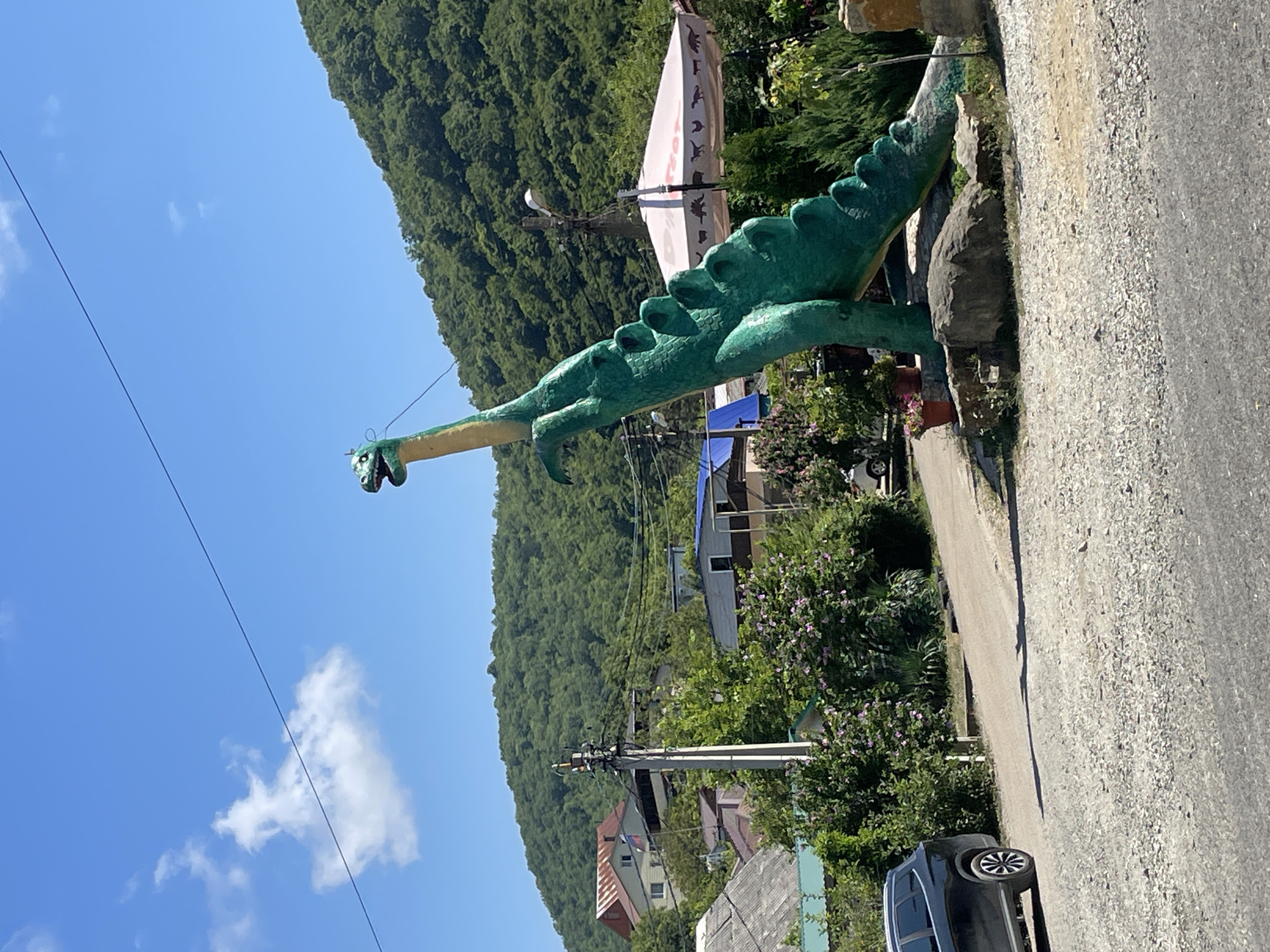 Giant Brontosaurus statue marks a roadside stop in Dzhubga, Russia