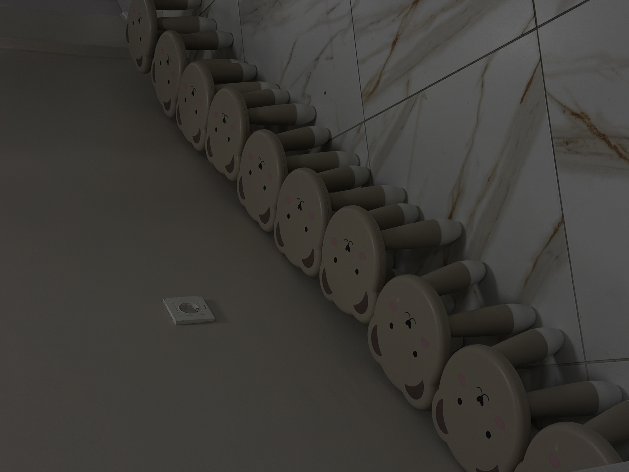 Cartoon bunny coat rack spotted on marble wall