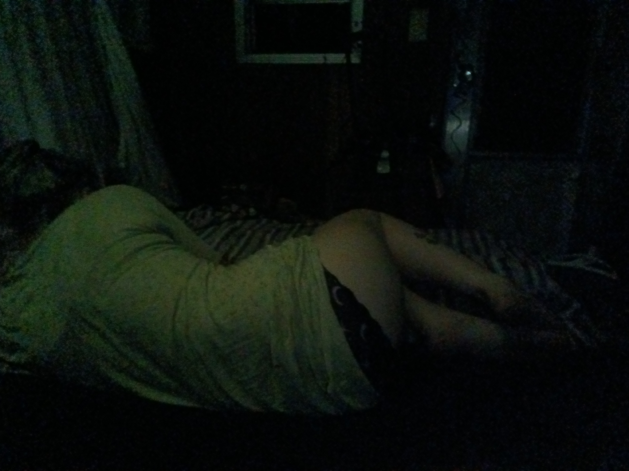 Person resting in darkened room in Park Hill