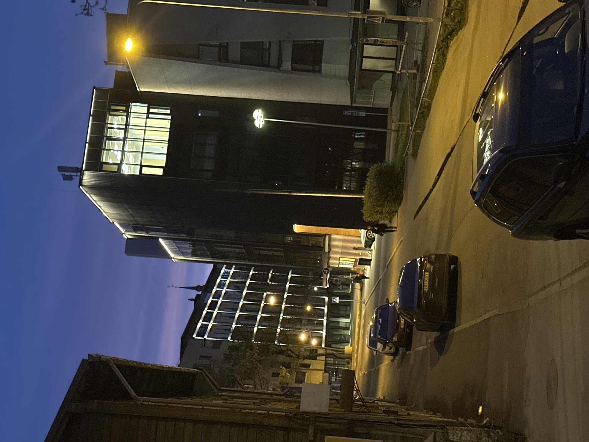 Illuminated modern building captured during Tallinn evening hours