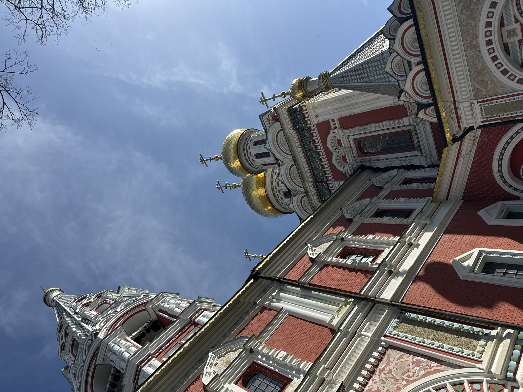 Tourist photographs historic Shipka Memorial Church in Bulgaria