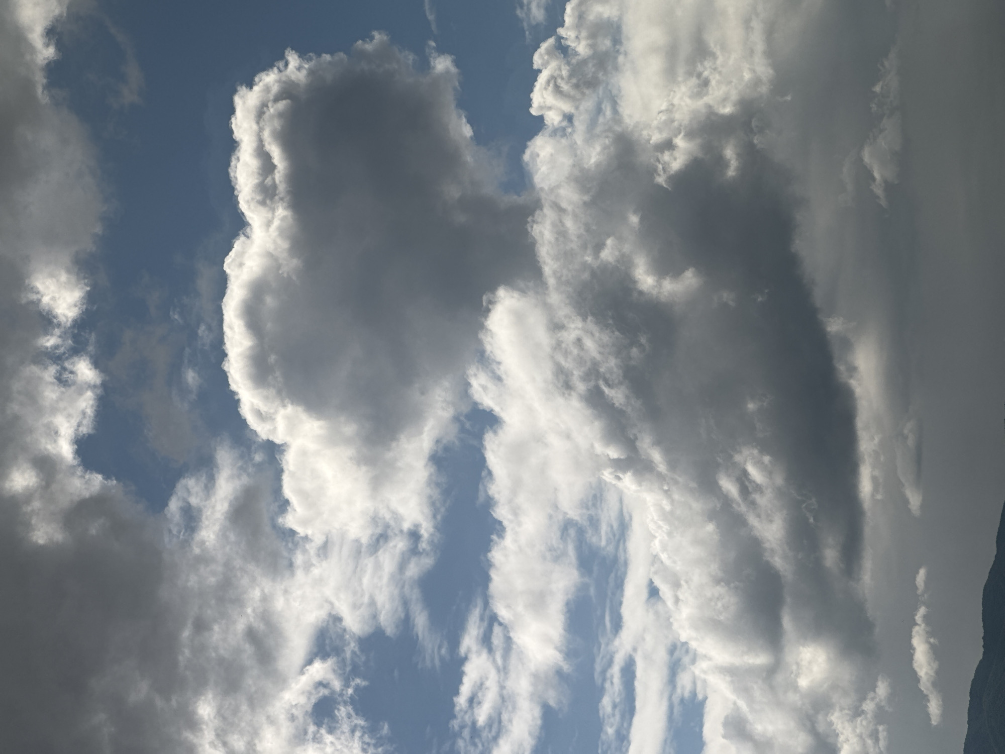 Witness Documents Dynamic Cloud Formations Against Blue Sky