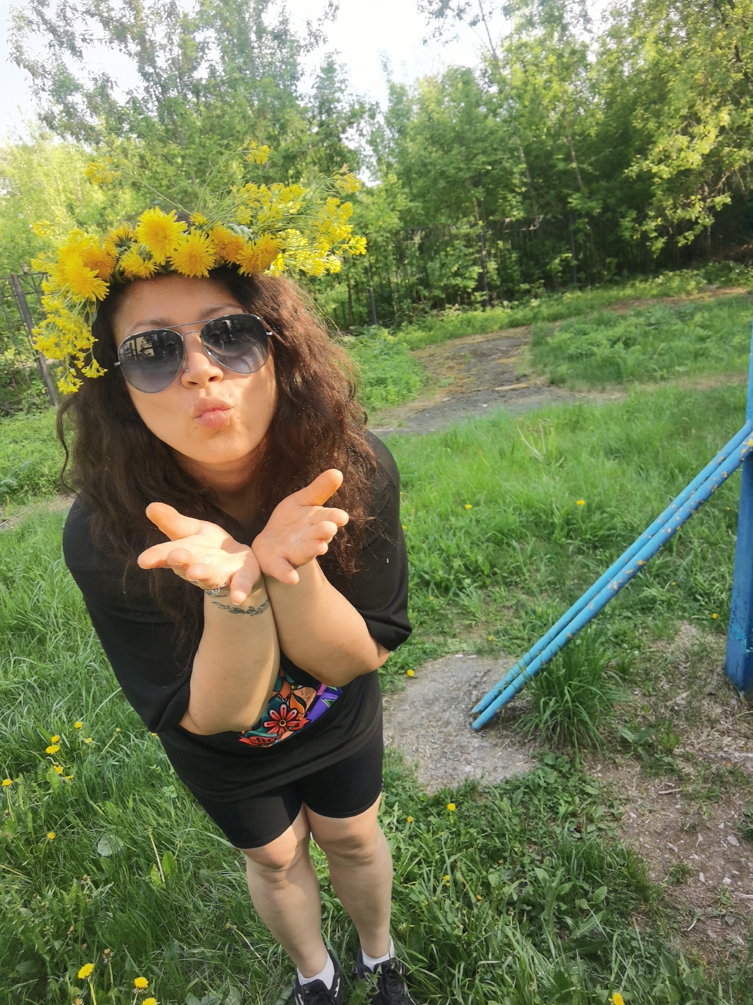 Woman in dandelion crown photographed in Perm park