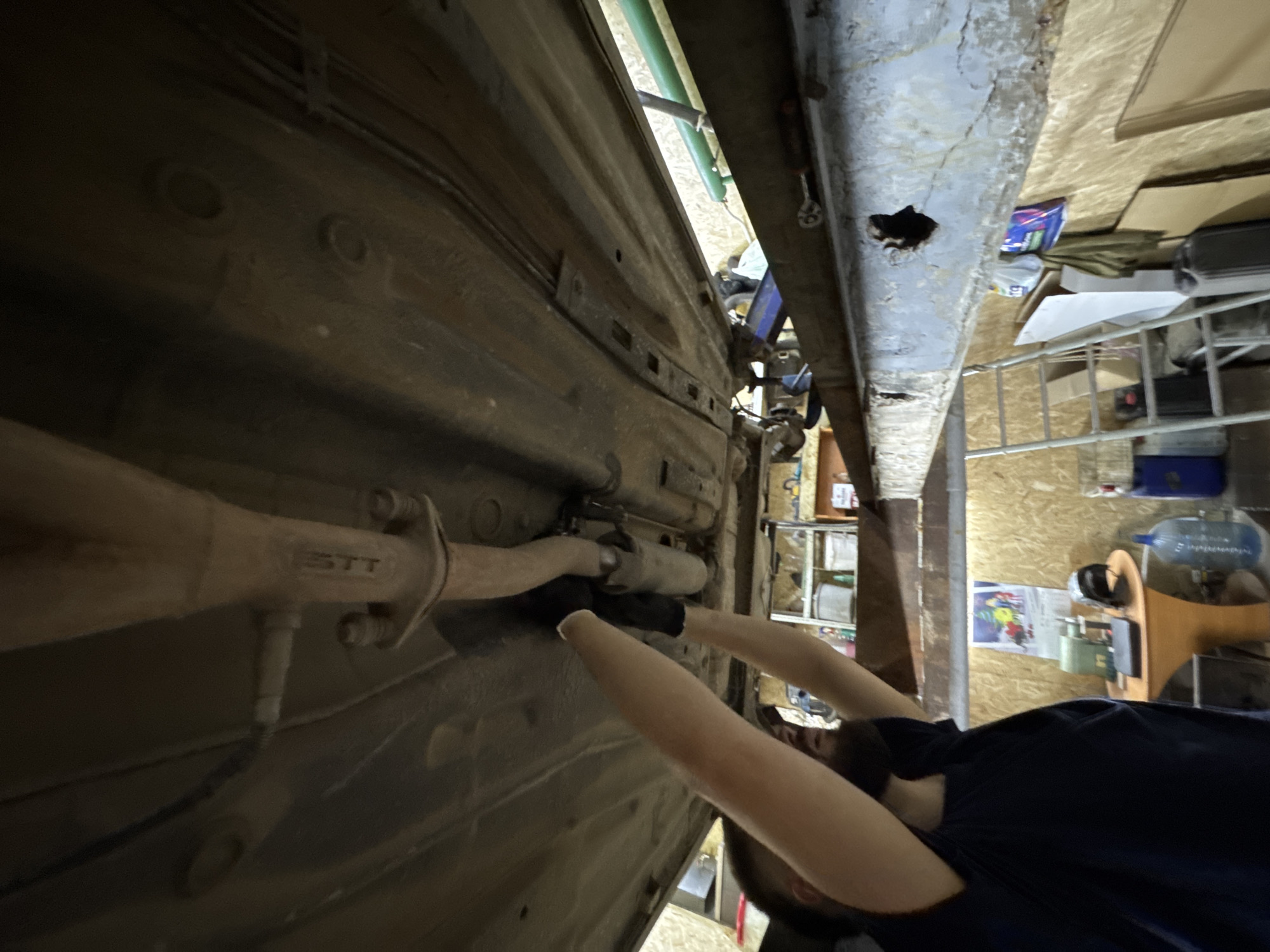 Mechanic performs routine car repair at Perm garage