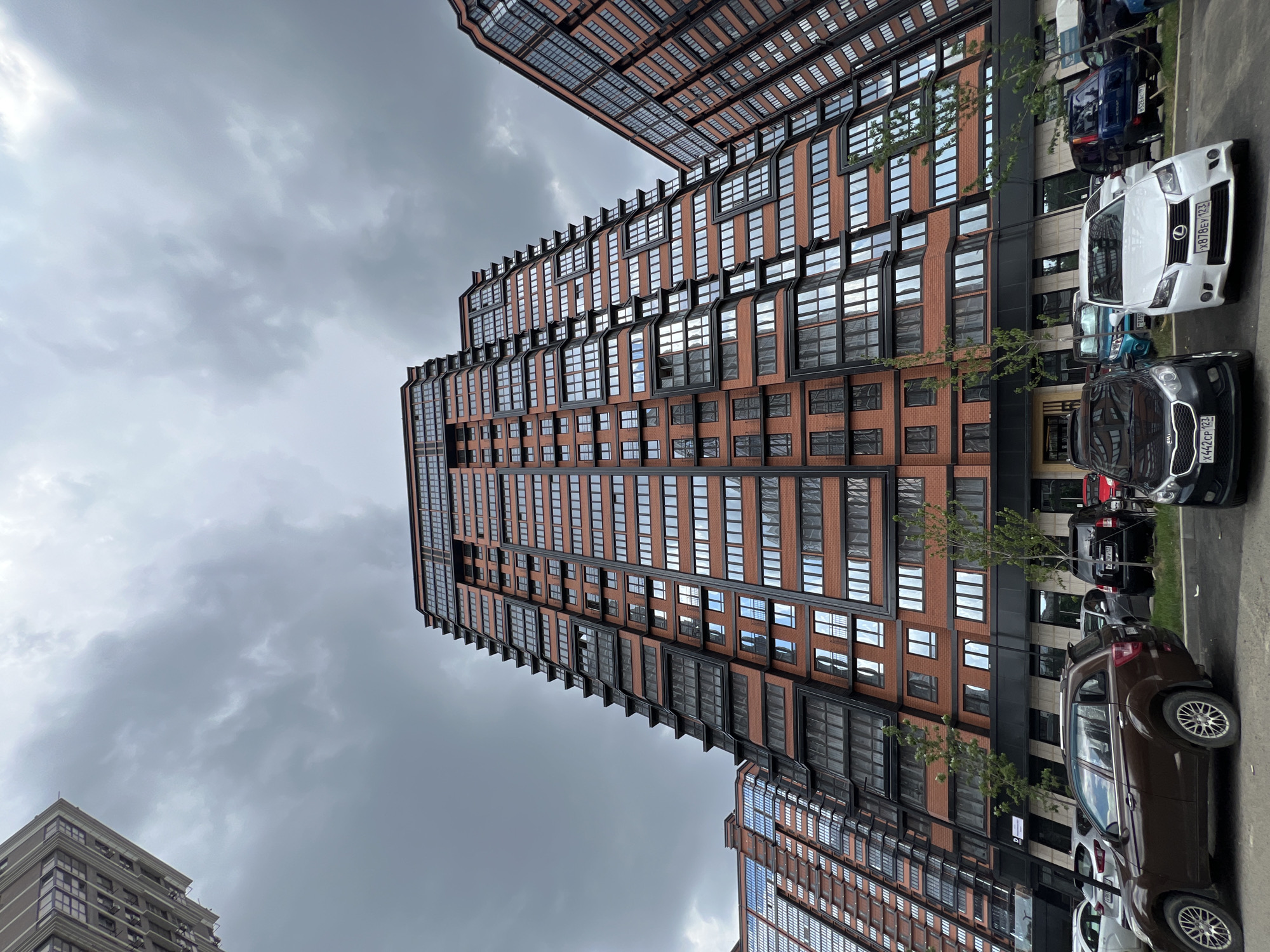 Modern brick apartment complex in Krasnodar, multiple angles