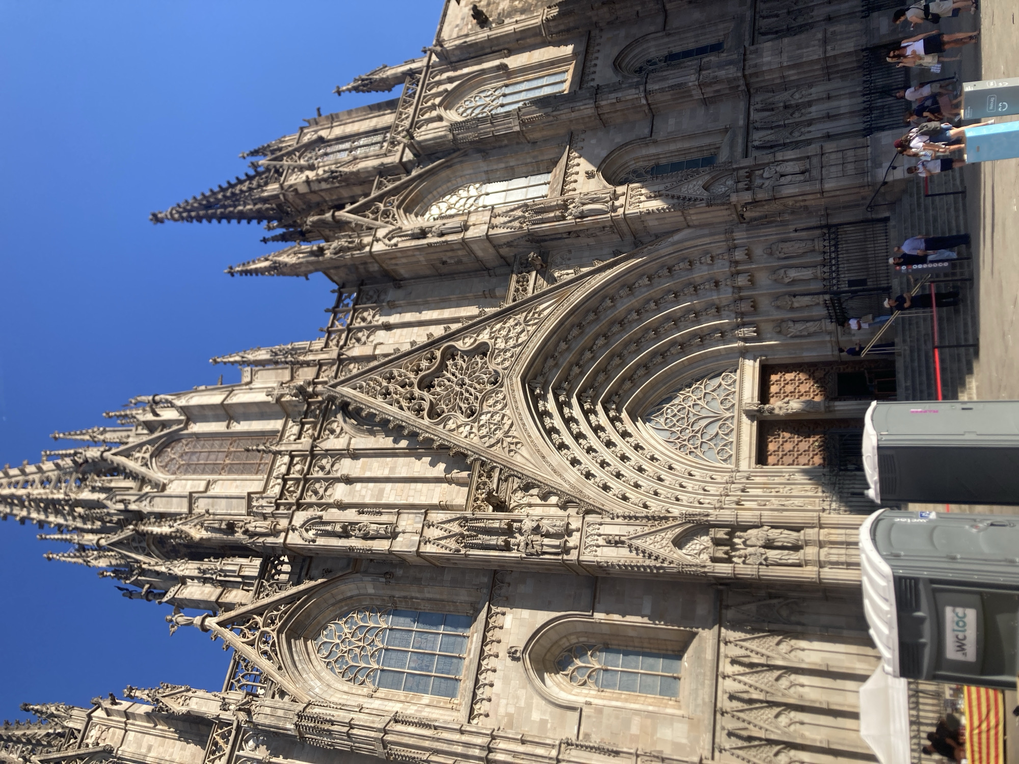 Gothic Quarter buzzes with crowds and event logistics on sunny afternoon