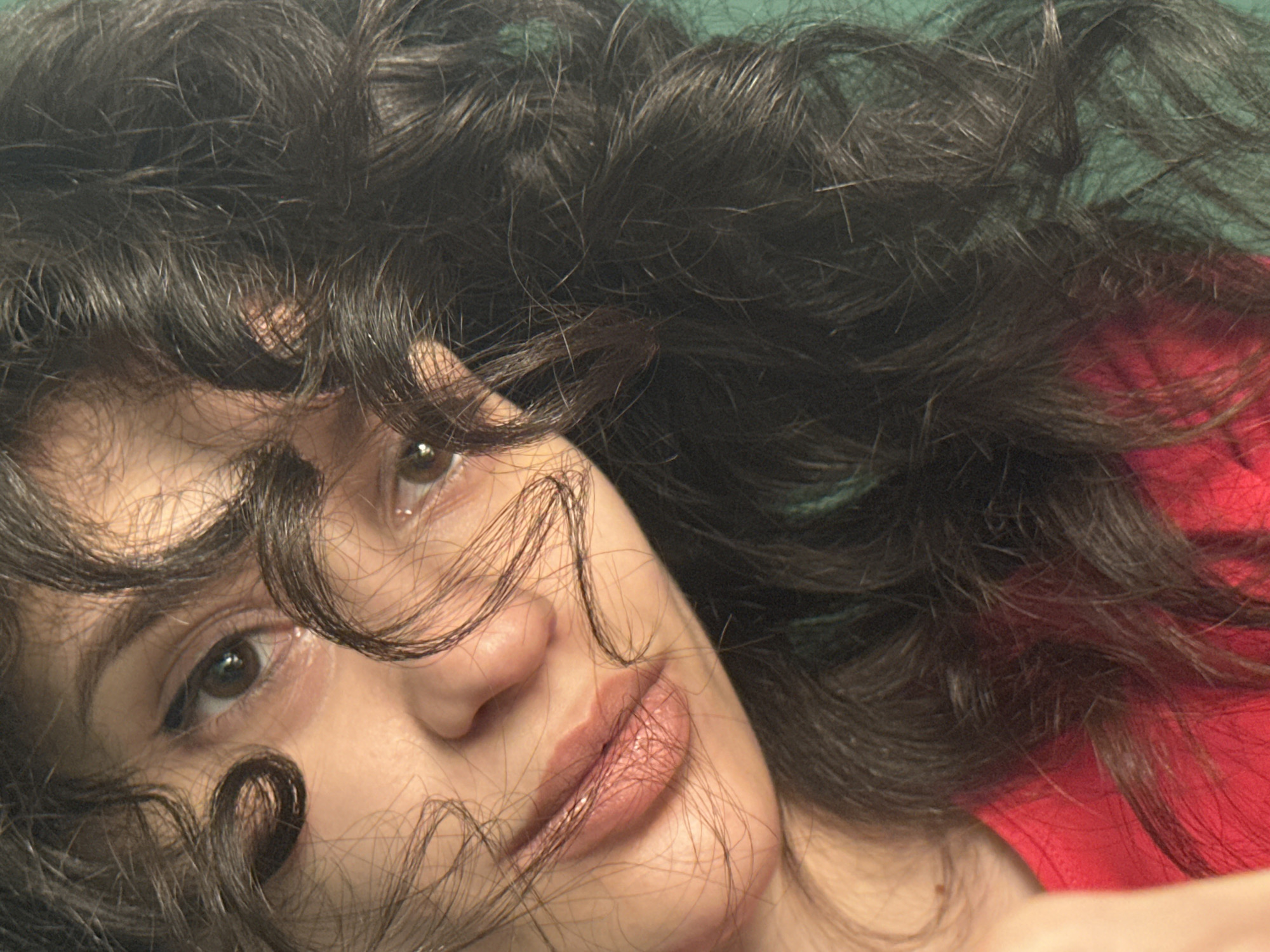 Woman takes 21 selfies in red shirt during evening in Sofia
