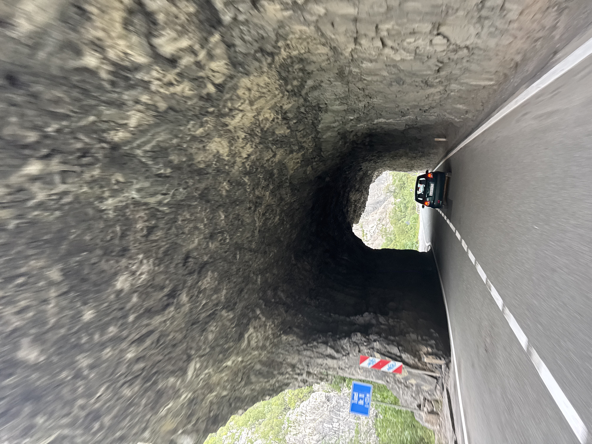 Driving through a rocky mountain tunnel in Montenegro