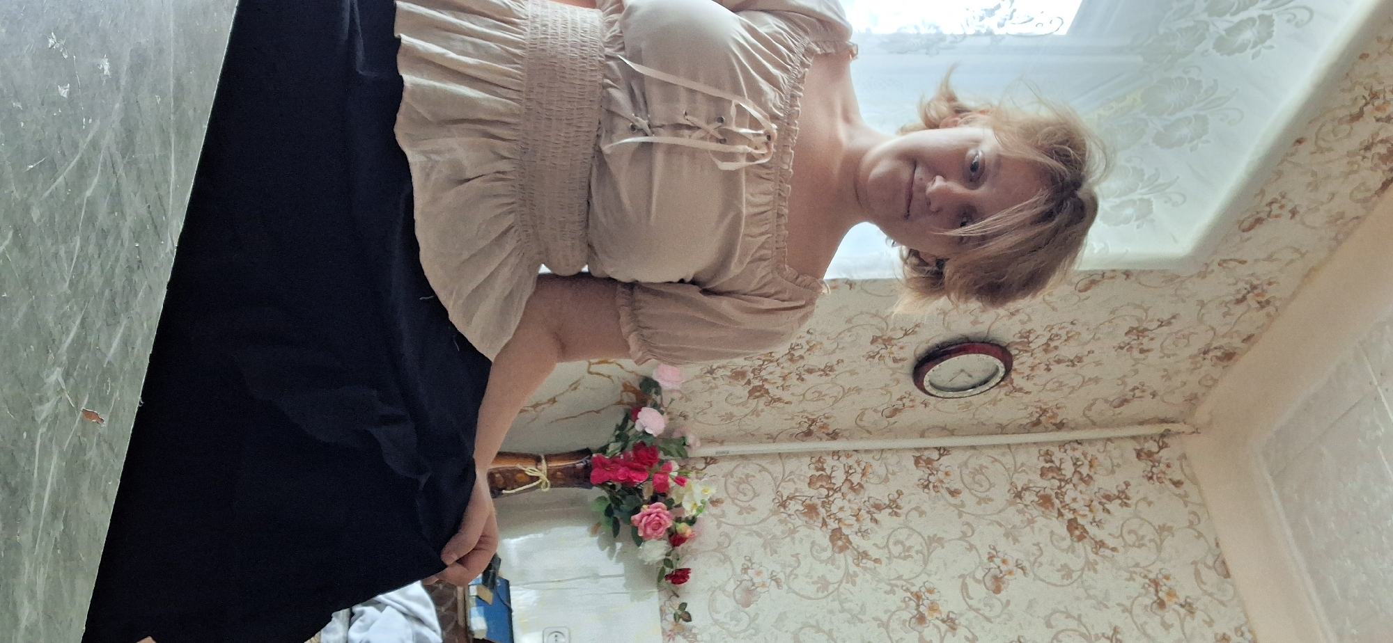 Indoor OOTD fashion shoot in Petropavl with ruffled blouse and white rose